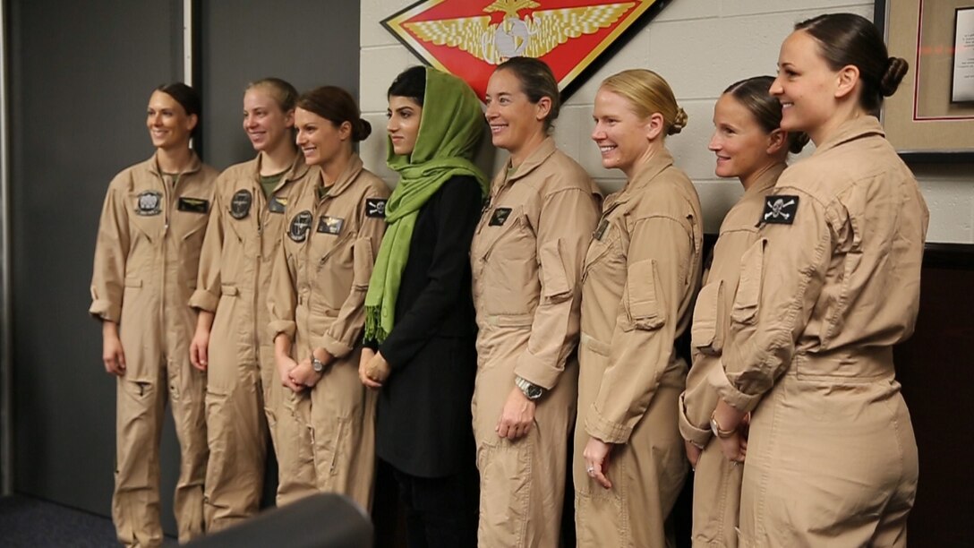 Female pilots with 3rd Marine Aircraft Wing pose for a photo with Afghan Capt. Niloofar Rahmani, the first female fixed-wing pilot in the Afghan Air Force, during a visit to Marine Corps Air Station Miramar, Calif., March 9.