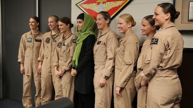 Female pilots with 3rd Marine Aircraft Wing pose for a photo with Afghan Capt. Niloofar Rahmani, the first female fixed-wing pilot in the Afghan Air Force, during a visit to Marine Corps Air Station Miramar, Calif., March 9.