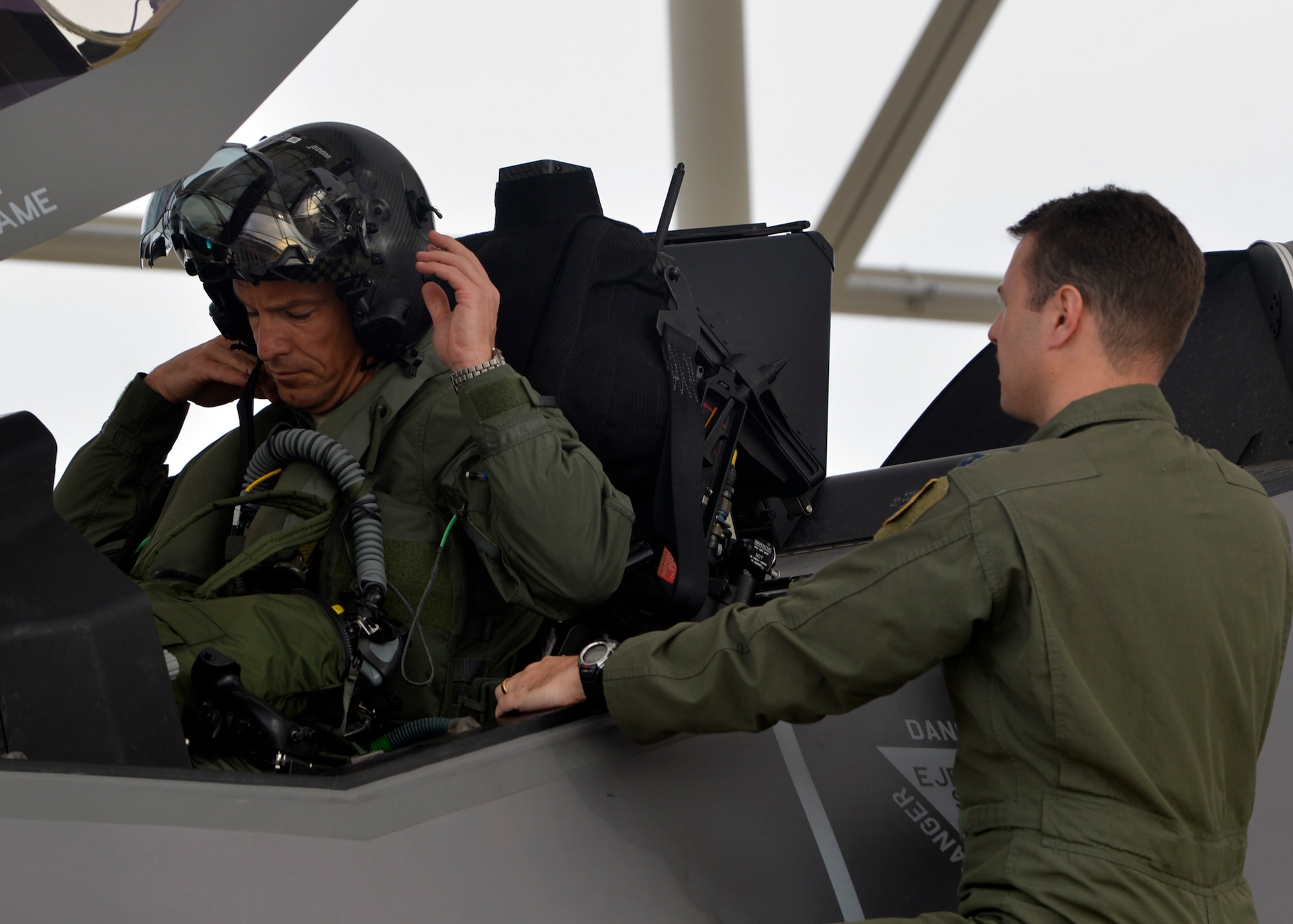 Brig. Gen. Scott Pleus dons his helmet before his first F-35 sortie flight March 18, 2015, at Luke Air Force Base, Ariz. Pleus is the commander of the 56th Fighter Wing. Pleus will now be the first commander to switch to the F-35 on Luke AFB. (U.S. Air Force photo/Senior Airman Devante Williams)