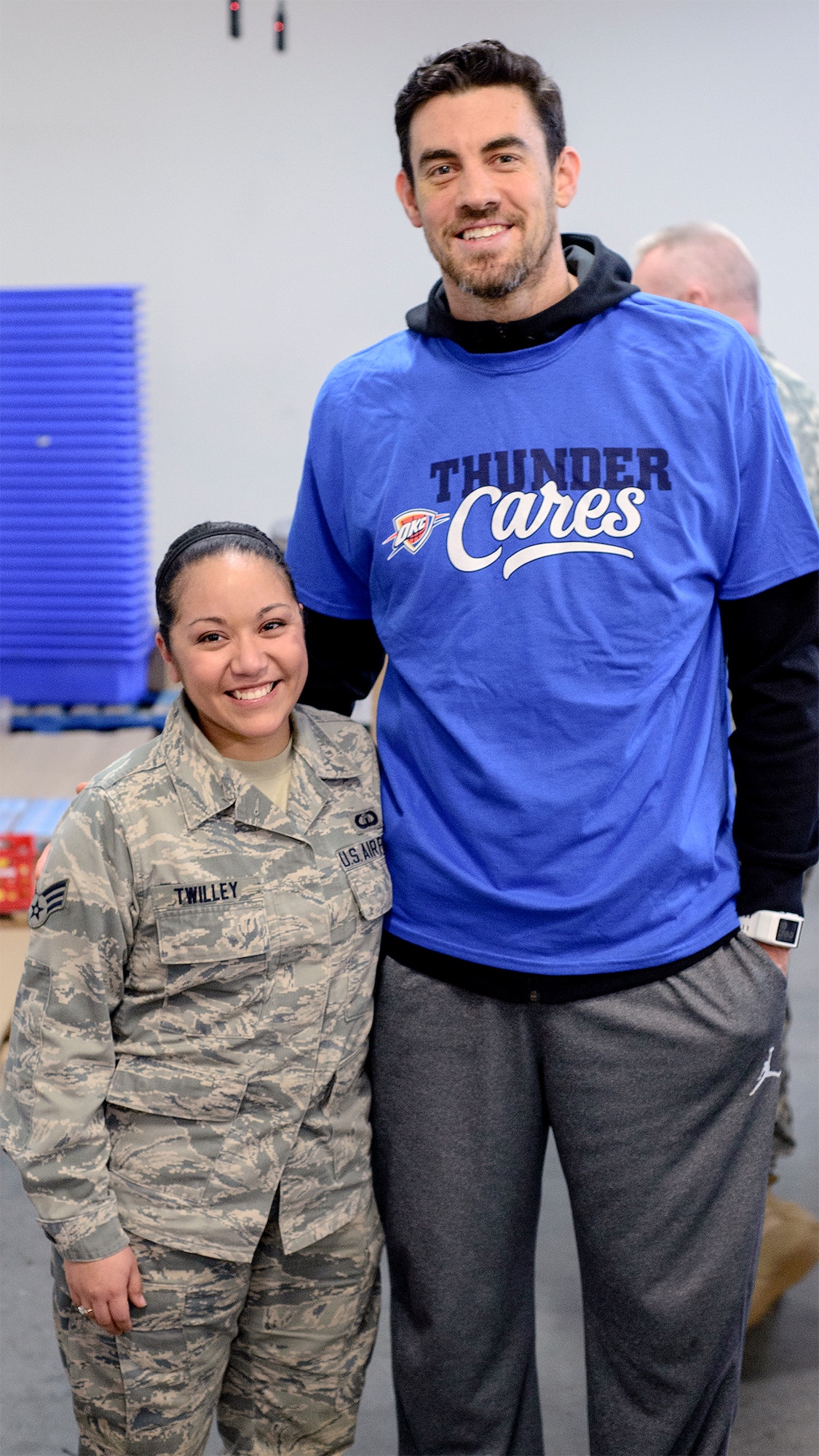 Airman Danica Gendron, a 71st Comptroller Squadron customer service technician, Vance Air Force Base, Oklahoma, packages food at the Regional Food Bank of Oklahoma in Oklahoma City March 9. Servicemembers from across the state teamed up with players from the Oklahoma City Thunder to package more than 20,000 pounds of food for Oklahoma families in 53 counties and 501 elementary schools. (U.S. Air Force photo \ David Poe)