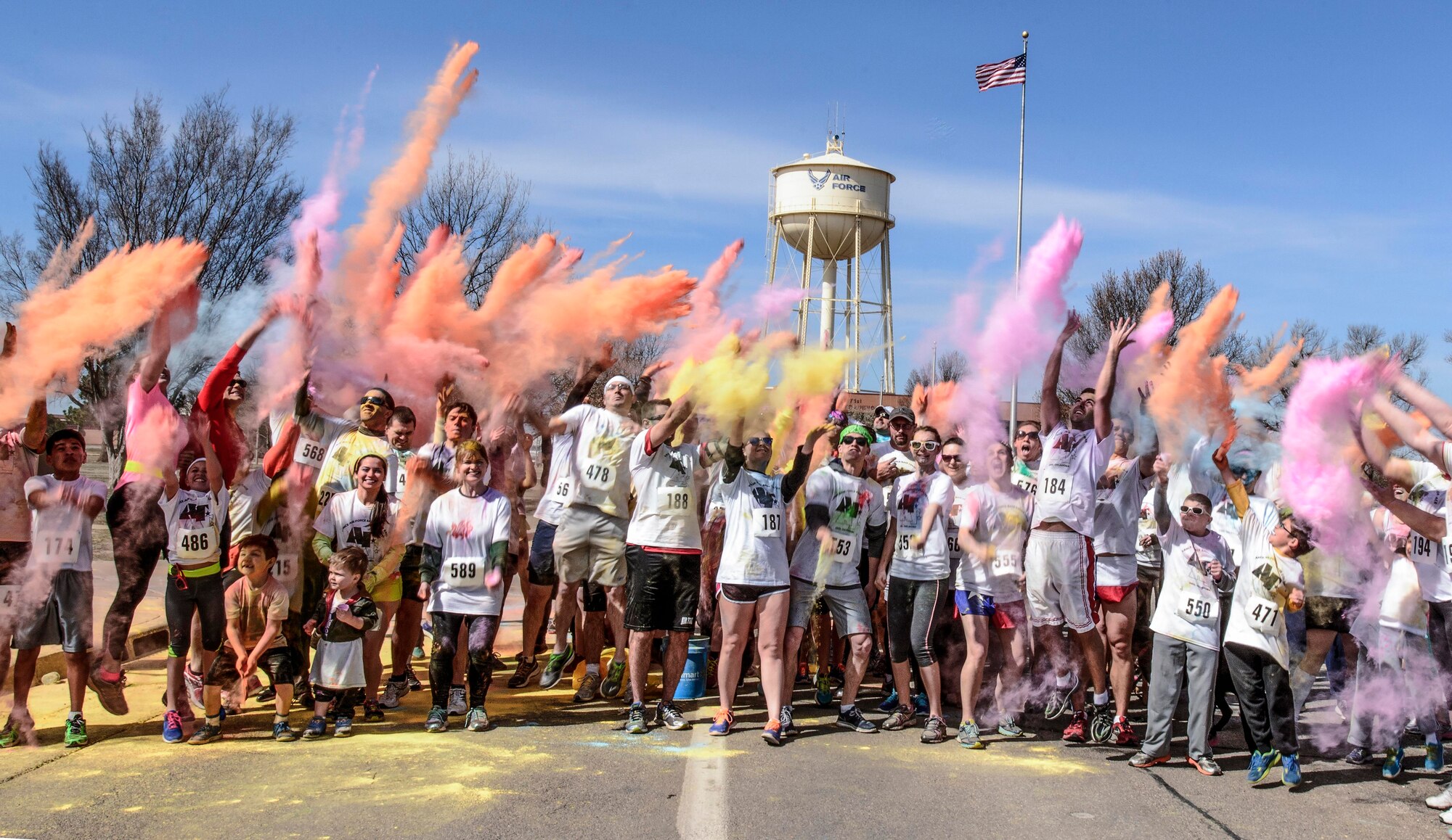 VANCE AIR FORCE BASE, Okla. -- Hundreds of Runners from Team Vance and the surrounding northwest Oklahoma community throw water soluble dyes into the air during the 71st Flying Training Wing’s first-ever color run March 14. Proceeds from the 5k race benefited the Air Force Assistance Fund. (U.S. Air Force photo / David Poe)