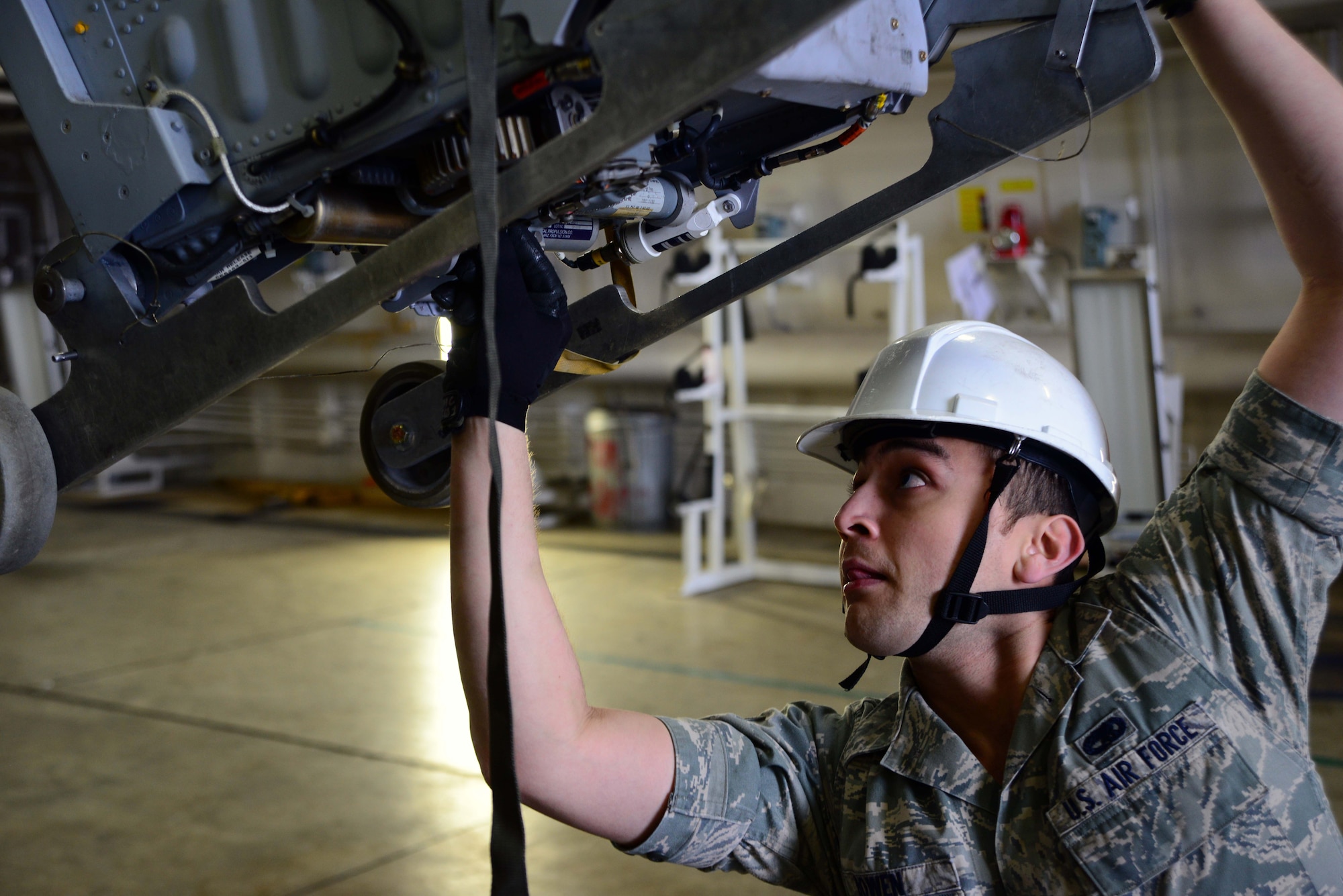 Senior Airman Jeffrey Bowen, 35th Maintenance Squadron egress systems, secures the seat of an F-16 Fighting Falcon on Feb. 20, 2015, at Misawa Air Base, Japan. After the jet’s seat and canopy are removed, they’re transported to the egress work bay and meticulously inspected for safety. (U.S. Air Force photo by Staff Sgt. Derek VanHorn)