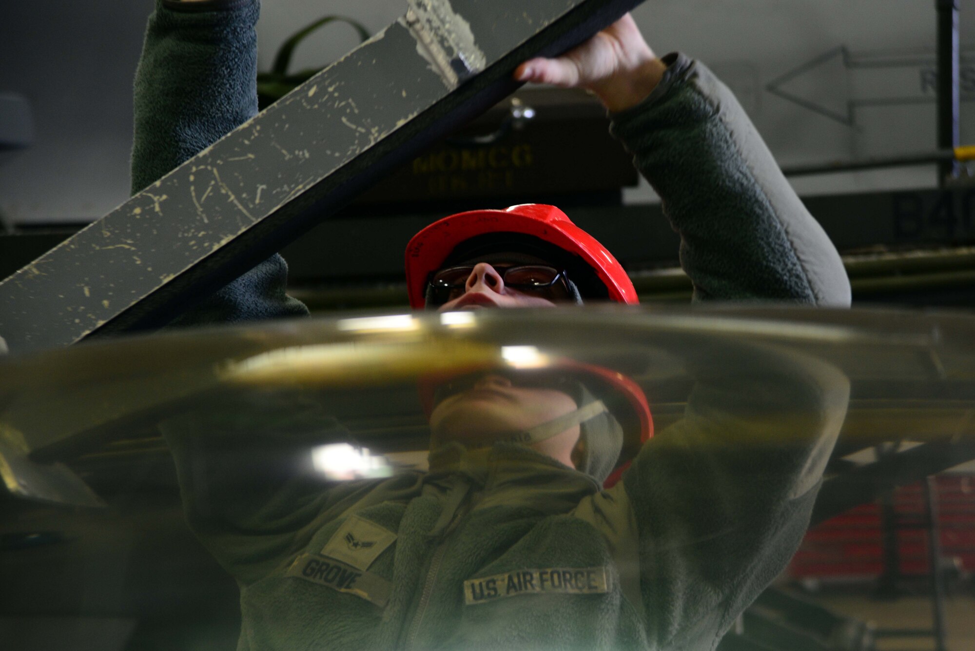 Airman 1st Class Calvin Grove, 35th Maintenance Squadron egress systems, fastens the canopy of an F-16 Fighting Falcon on Feb. 20, 2015, at Misawa Air Base, Japan. Egress performs scheduled maintenance on the seats and canopies of the entire F-16 fleet at Misawa. (U.S. Air Force photo by Staff Sgt. Derek VanHorn)