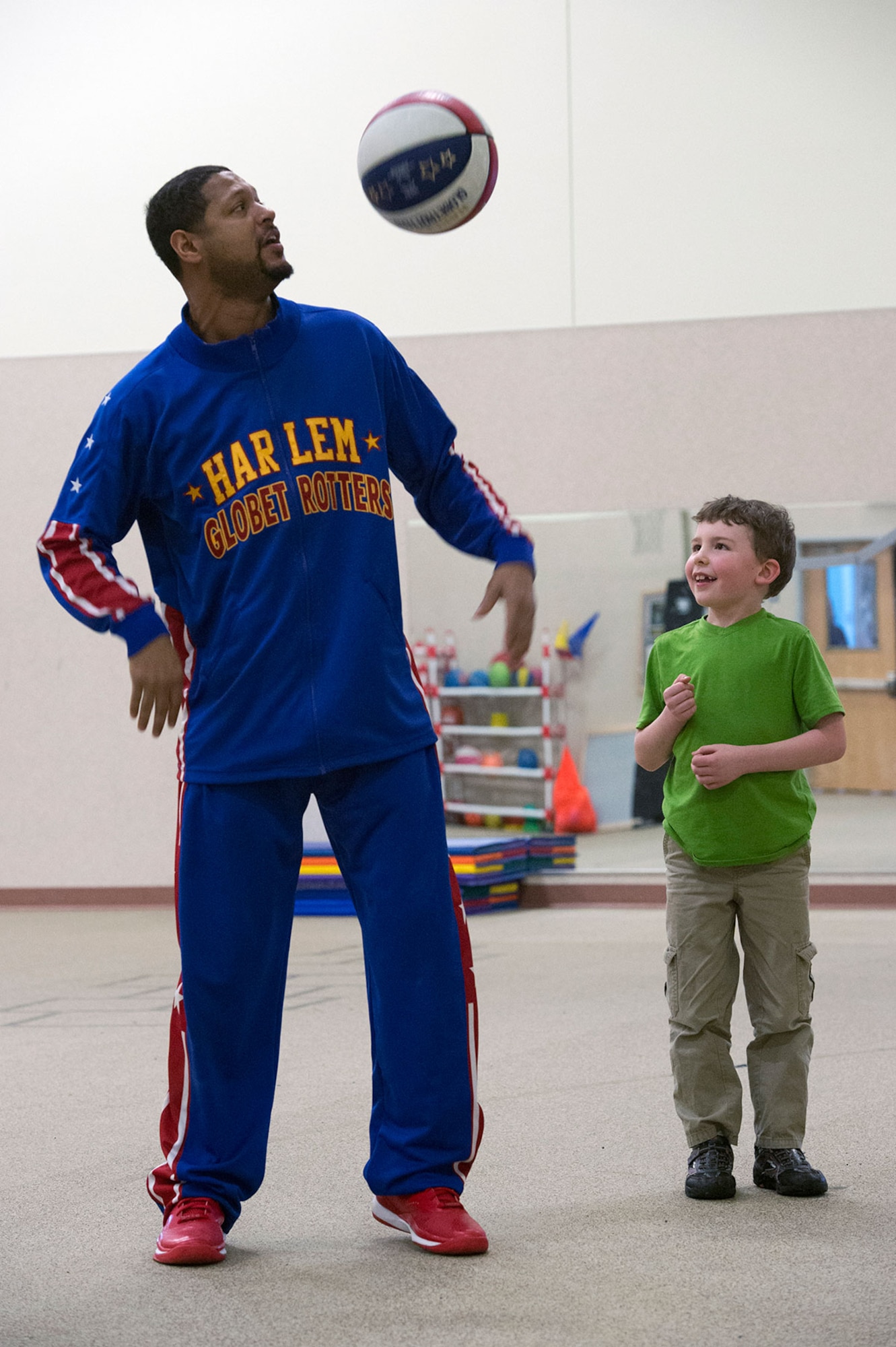 Harlem Globetrotter Handles Franklin visits Illa School Age Program children on Joint Base Elmendorf-Richardson to discuss bullying prevention, March 17, 2015. Known worldwide as the "Ambassadors of Goodwill"™, the iconic Harlem Globetrotters presented the community outreach program, "The ABCs of Bullying Prevention," in an effort to impact schools and communities around the world as well as and provide tools that kids can use on a daily basis to reduce bullying. (U.S. Air Force photo/Alejandro Pena)