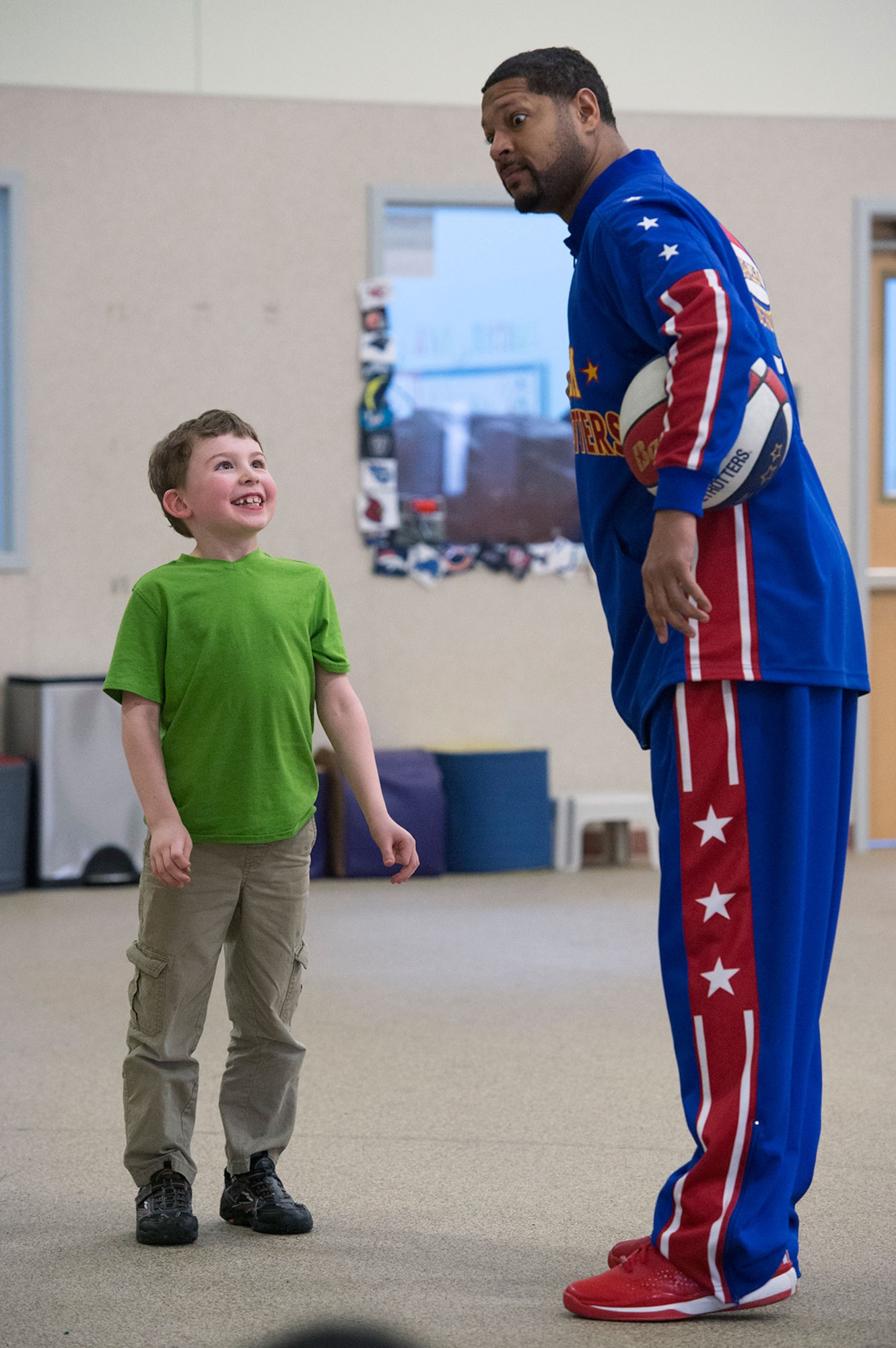 Harlem Globetrotter Handles Franklin visits Illa School Age Program children on Joint Base Elmendorf-Richardson to discuss bullying prevention, March 17, 2015. Known worldwide as the "Ambassadors of Goodwill"™, the iconic Harlem Globetrotters presented the community outreach program, "The ABCs of Bullying Prevention," in an effort to impact schools and communities around the world as well as and provide tools that kids can use on a daily basis to reduce bullying. (U.S. Air Force photo/Alejandro Pena)
