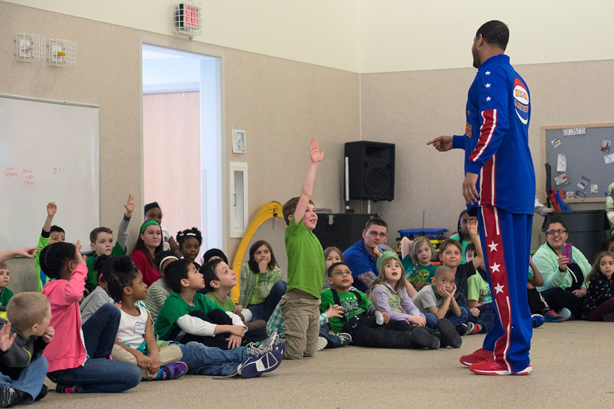 Harlem Globetrotter Handles Franklin visits Illa School Age Program children on Joint Base Elmendorf-Richardson to discuss bullying prevention, March 17, 2015. Known worldwide as the "Ambassadors of Goodwill"™, the iconic Harlem Globetrotters presented the community outreach program, "The ABCs of Bullying Prevention," in an effort to impact schools and communities around the world as well as and provide tools that kids can use on a daily basis to reduce bullying. (U.S. Air Force photo/Alejandro Pena)
