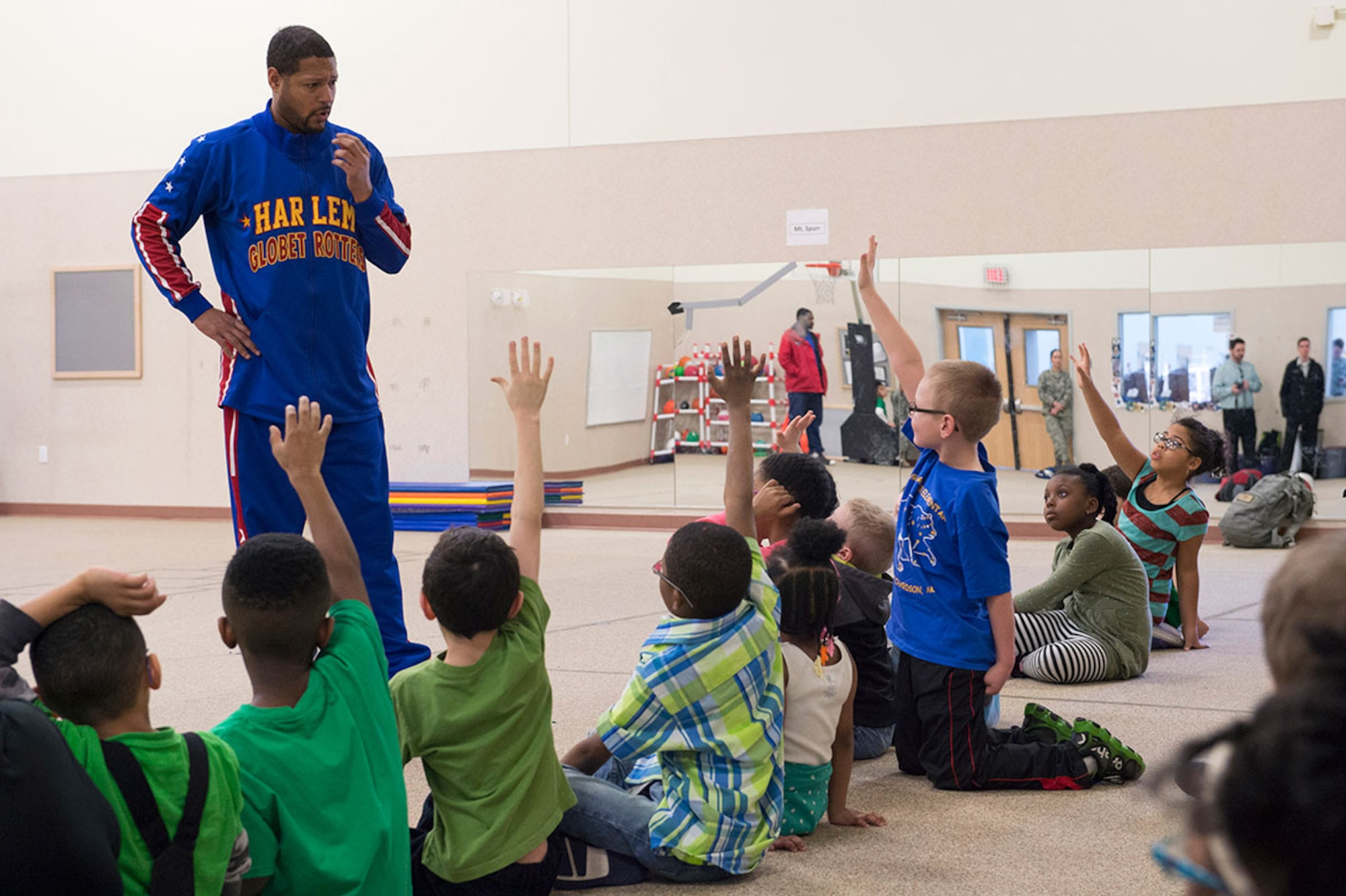 Harlem Globetrotter Handles Franklin visits Illa School Age Program children on Joint Base Elmendorf-Richardson to discuss bullying prevention, March 17, 2015. Known worldwide as the "Ambassadors of Goodwill"™, the iconic Harlem Globetrotters presented the community outreach program, "The ABCs of Bullying Prevention," in an effort to impact schools and communities around the world as well as and provide tools that kids can use on a daily basis to reduce bullying. (U.S. Air Force photo/Alejandro Pena)