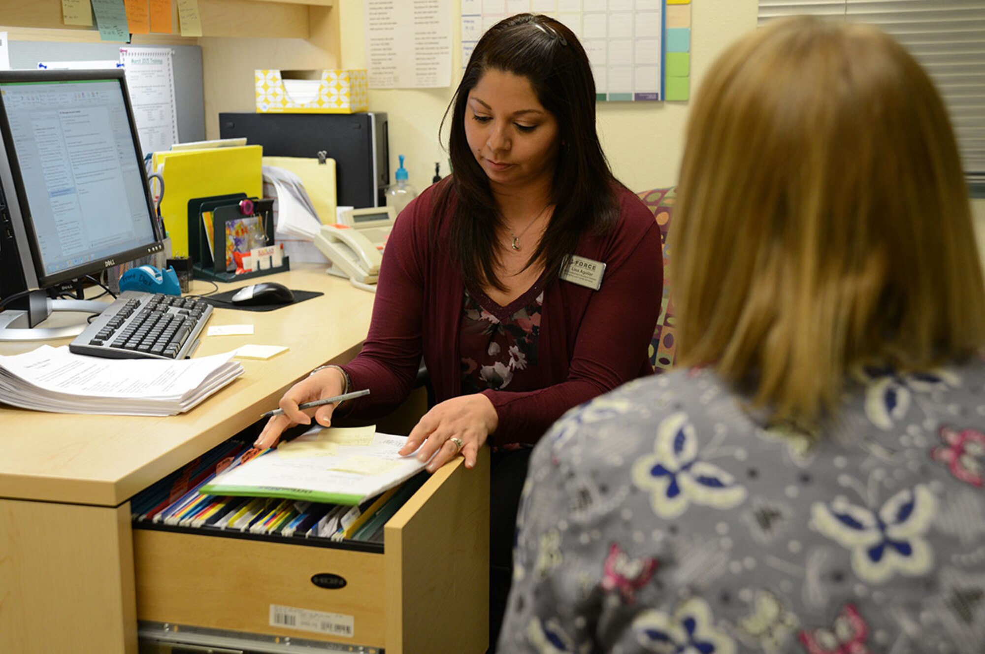 Lisa Aguilar, assistant director of the Talkeetna Child Development Center, checks on not only teachers and care givers but also is there for the employees to turn to at the Talkeetna Child Development Center on March 3, 2015. Aguilar manages a schedule for more than 80 staff daily and attempts to stay in touch with approximately 240 families. (Air Force Photo/Airman Christopher R. Morales)