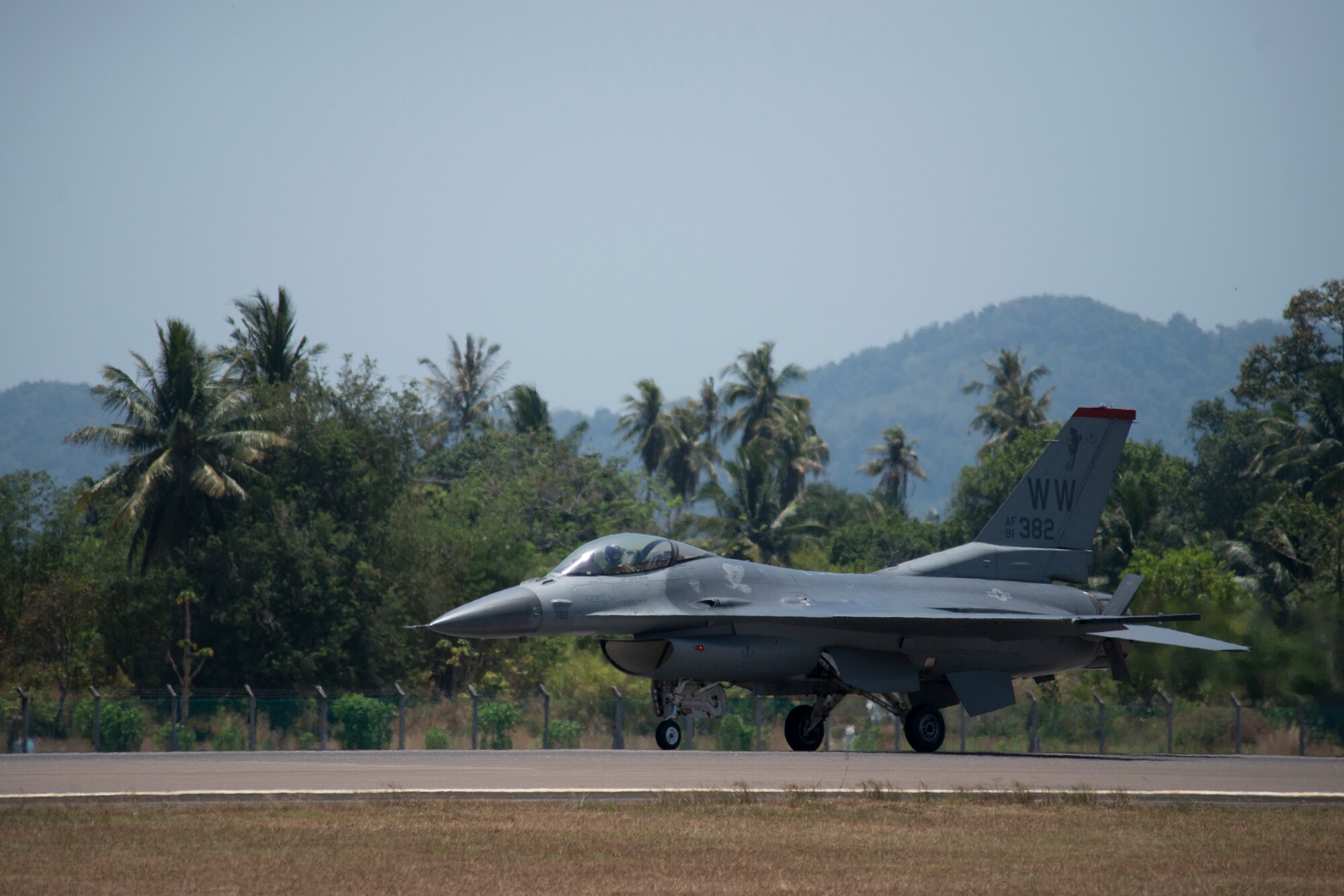 An F-16 Fighting Falcon, flown by Capt. Austin Brown, a Pacific Air Forces Demonstration Team pilot, provides a demonstration of the F-16s capabilities to a crowd at the Langkawi International Maritime and Aerospace Exhibition, March 16, 2015. Defense Department participation in the LIMA 15 airshow strengthens military-to-military relationships and underscores the cooperation agreements between the U.S. and Malaysia. (U.S. Air Force photo by 1st Lt. Elias Zani/Released)