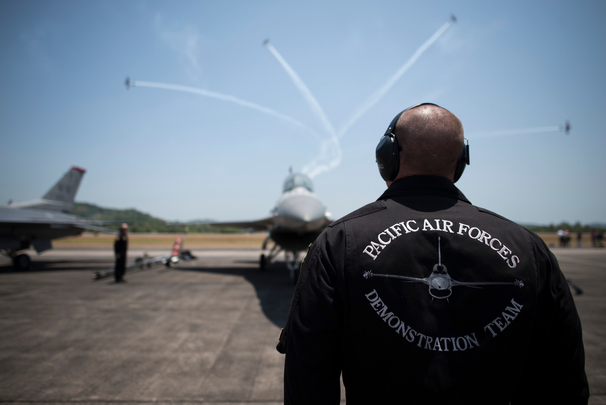 The crew of the Pacific Air Forces' Demonstration Team prepare an F-16 Fighting Falcon before a demonstration at the Langkawi International Maritime and Aerospace Exhibition, Malaysia, March 17, 2015. Defense Department participation in the LIMA 15 airshow strengthens military-to-military relationships and underscores the cooperation agreements between the U.S. and Malaysia. (U.S. Air Force photo by 1st Lt. Elias Zani/Released)