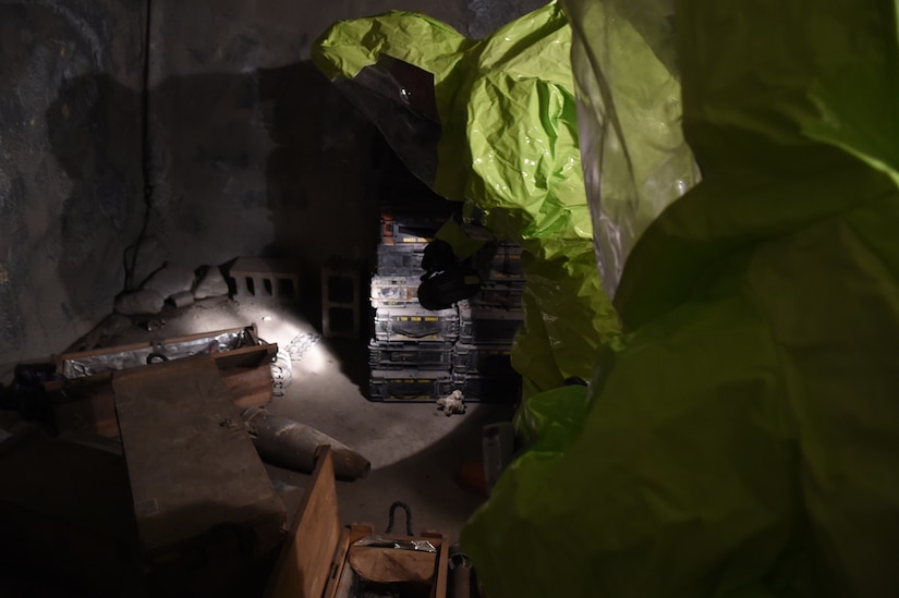 Airman Marlene Zeledon (left) and Staff Sgt. Jonathan Moroz (right) discover a munitions stockpile in a mock chemical lab for a training exercise in the Memorial Tunnel at the Center for National Response in Gallagher, WV., March 17, 2015. This training is part of the annual Black Flag exercise for first responders. Zeledon is an 11th Civil Engineer Squadron emergency management journeyman and Moroz is the 779th Aerospace Medical Squadron non-commissioned officer in-charge of bioenvironmental training Joint Base Andrews, Md. (U.S. Air Force photo/Airman 1st Class Joshua R. M. Dewberry)