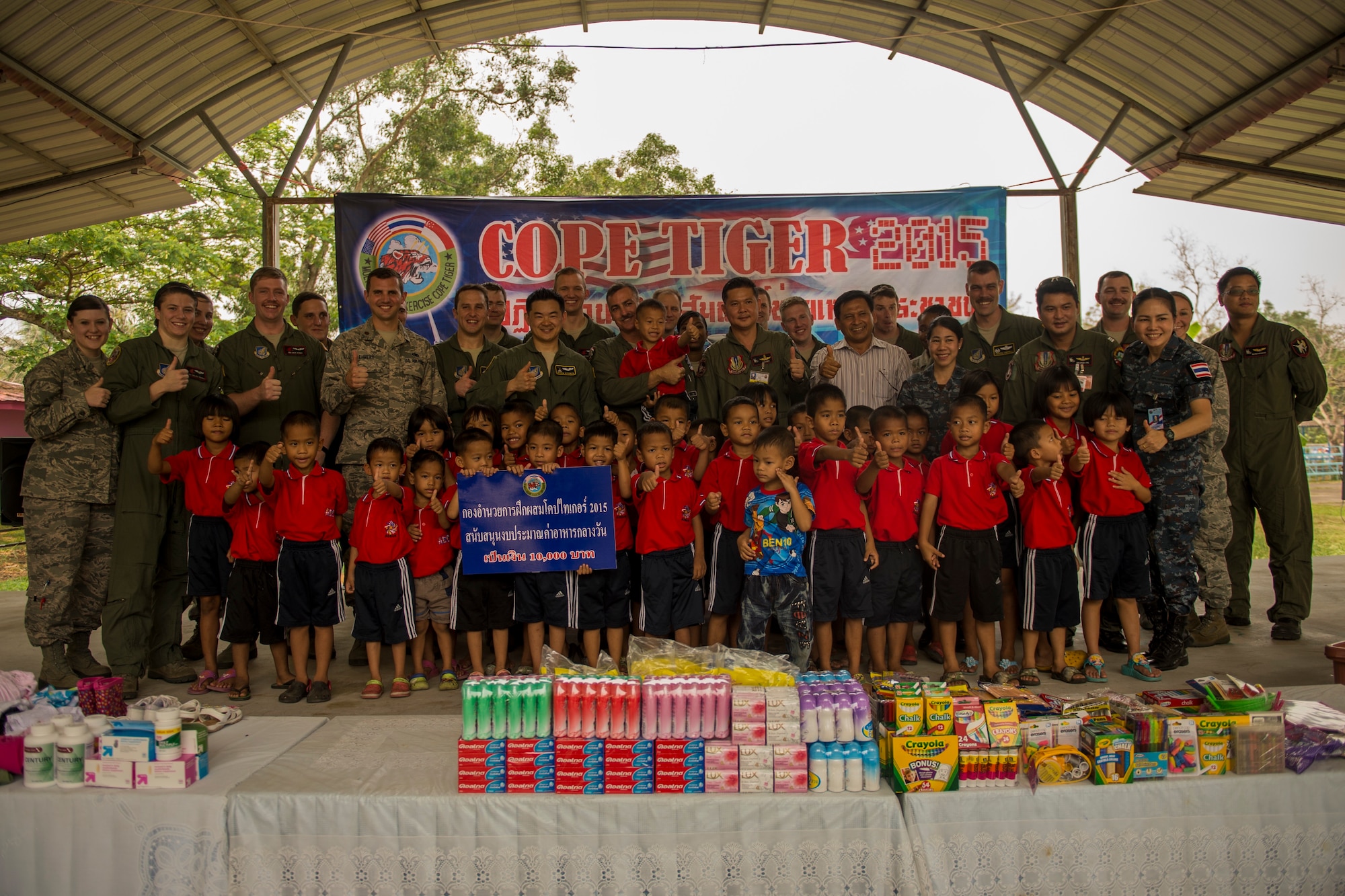 U.S. and Thai Airmen visit and donate clothing and other supplies to a local boys and girls shelter in Udon Thani, Thailand, March 18, 2015. CT15 includes 22 total flying units and over 1390 personnel from three countries and continues the growth of strong, interoperable, and beneficial relationships within the Asia-Pacific region through integration of airborne and land-based command and control assets.(U.S. Air Force photo by Airman 1st Class Taylor Queen/Released)
