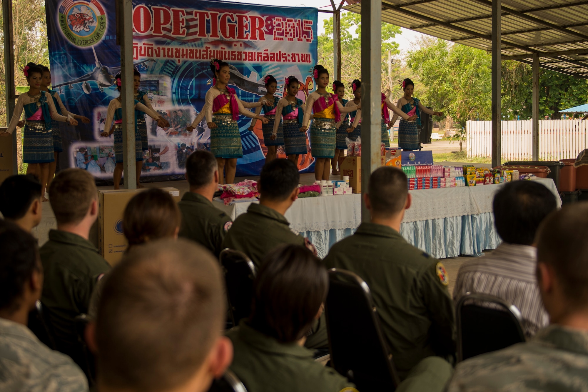 U.S. Air Force Airmen watch a dance during a visit to a local boys and girls shelter in Udon Thani, Thailand, March 18, 2015. CT15 includes 22 total flying units and over 1390 personnel from three countries and continues the growth of strong, interoperable, and beneficial relationships within the Asia-Pacific region through integration of airborne and land-based command and control assets.(U.S. Air Force photo by Airman 1st Class Taylor Queen/Released)