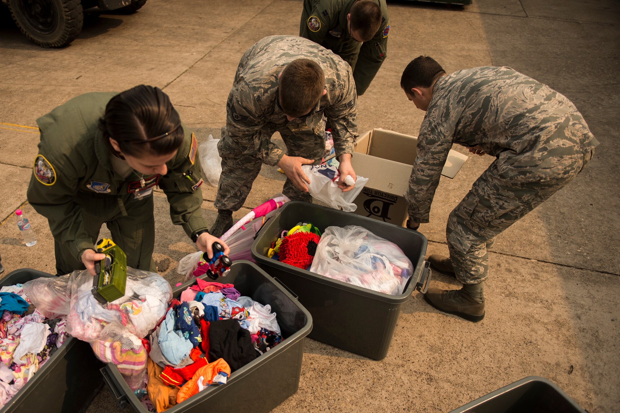 U.S. Air Force Airmen pack supplies being donated to a local boys and girls shelter in Udon Thani, Thailand, March 18, 2015. CT15 includes 22 total flying units and over 1390 personnel from three countries and continues the growth of strong, interoperable, and beneficial relationships within the Asia-Pacific region through integration of airborne and land-based command and control assets.(U.S. Air Force photo by Airman 1st Class Taylor Queen/Released)