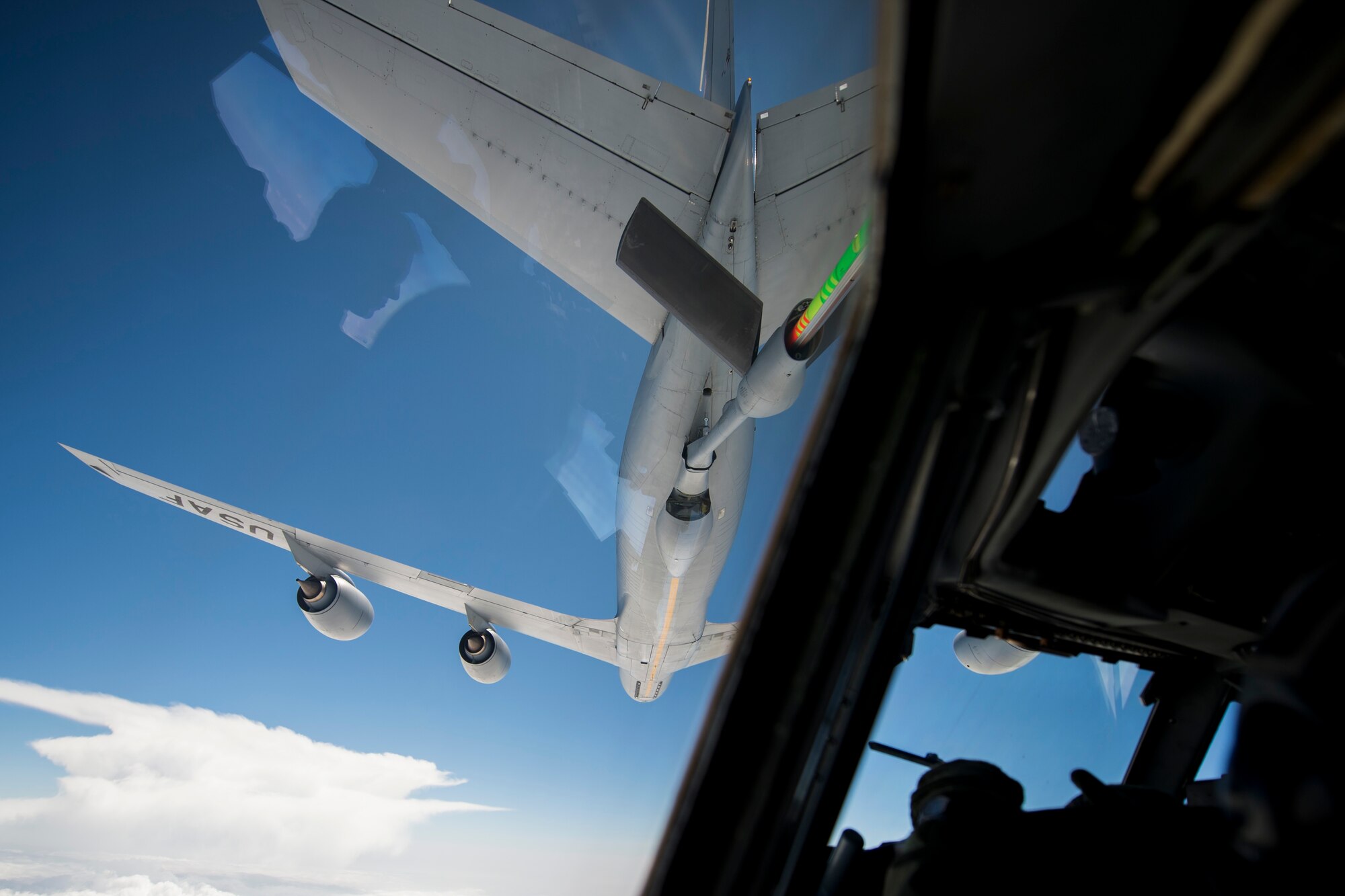 A U.S. Air Force KC-135 refuels an E-3 Sentry in air during Exercise Cope Tiger 15 near Korat, Thailand, March 12, 2015. CT15 includes 22 total flying units and over 1390 personnel from three countries and continues the growth of strong, interoperable, and beneficial relationships within the Asia-Pacific region through integration of airborne and land-based command and control assets.(U.S. Air Force photo by Airman 1st Class Taylor Queen/Released)