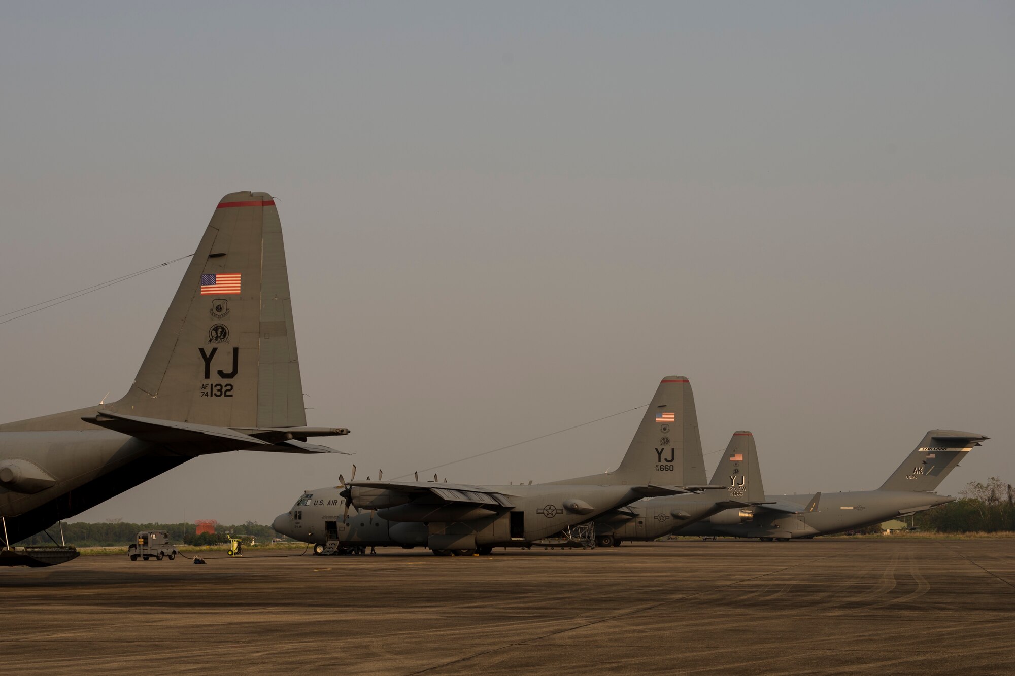 Three U.S. C-130's and two U.S. C-17's participate in Exercise Cope Tiger 15 near Udon, Thailand, March 11, 2015. CT15 includes 22 total flying units and over 1390 personnel from three countries and continues the growth of strong, interoperable, and beneficial relationships within the Asia-Pacific region through integration of airborne and land-based command and control assets.(U.S. Air Force photo by Airman 1st Class Taylor Queen/Released)