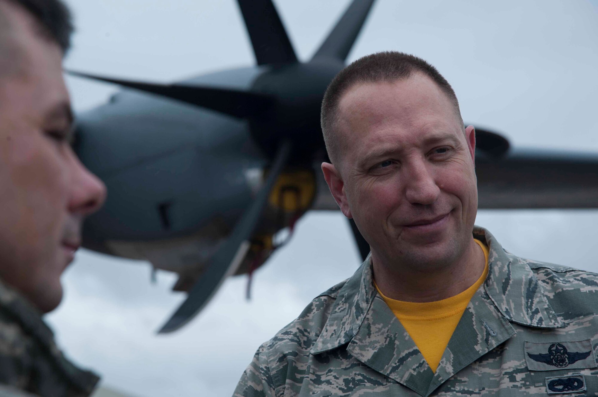 Chief Master Sgt. Robert Boyer, 19th Air Force command chief, talks to Airmen from the 314th Aircraft Maintenance Squadron March 13, 2015, at Little Rock Air Force Base, Ark. Boyer met with Senior Airman Laketa Kinghorne, a 314th Aircraft Maintenance Squadron member, who showed him an initiative created by the communication navigation shop to repair communication cords. (U.S. Air Force photo by Senior Airman Kaylee Clark)