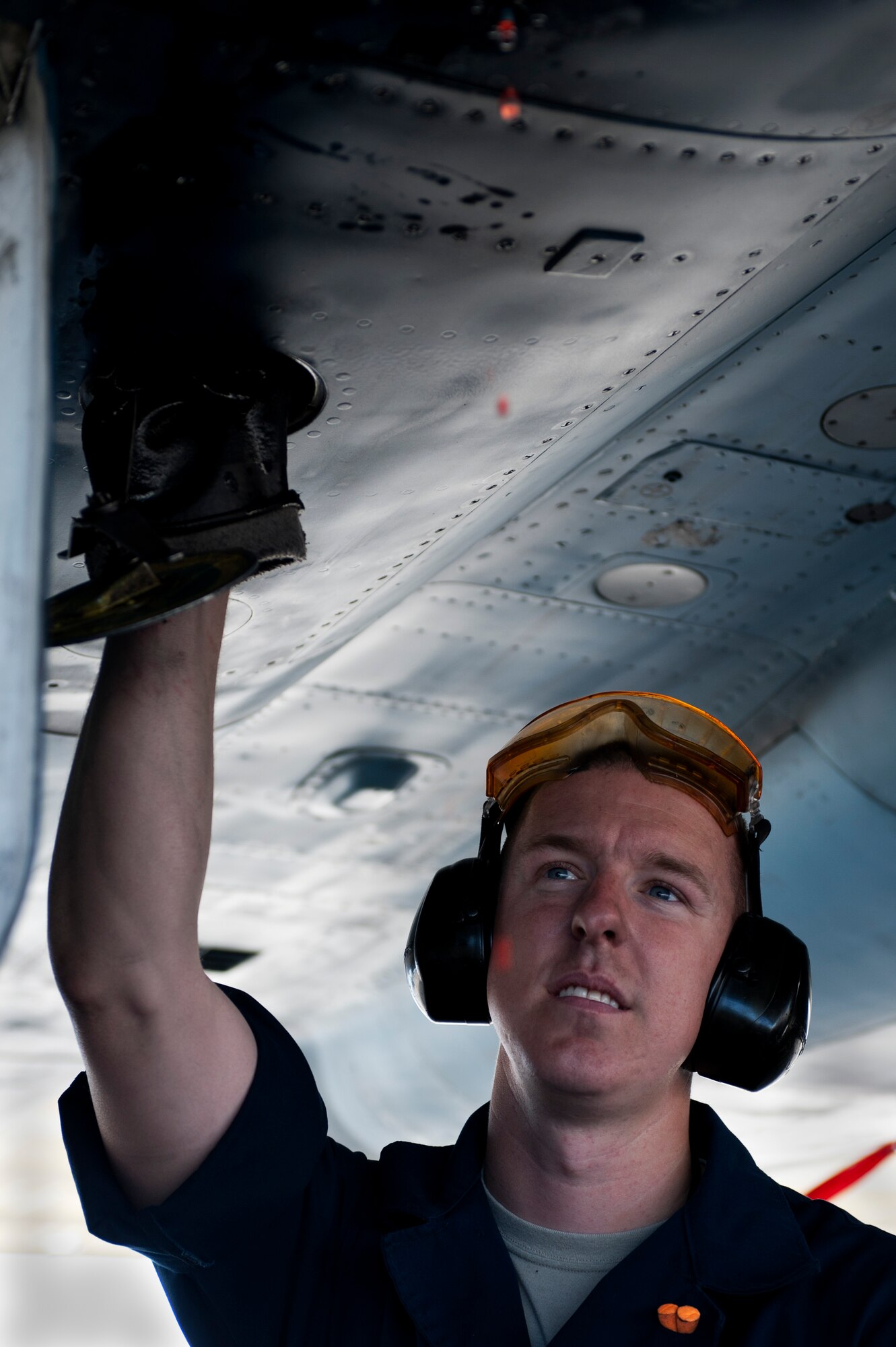 Senior Airman Jaymes Meluin, 757th Aircraft Maintenance Squadron crew chief, checks for a hydraulic leak on an F-15E Strike Eagle assigned to the 64th Aggressor Squadron prior to a Red Flag 15-2 sortie at Nellis Air Force Base, Nev., March 12, 2015. Red Flag 15-2 marked the aircrafts’ last involvement prior to being relocated to an Air National Guard base. 