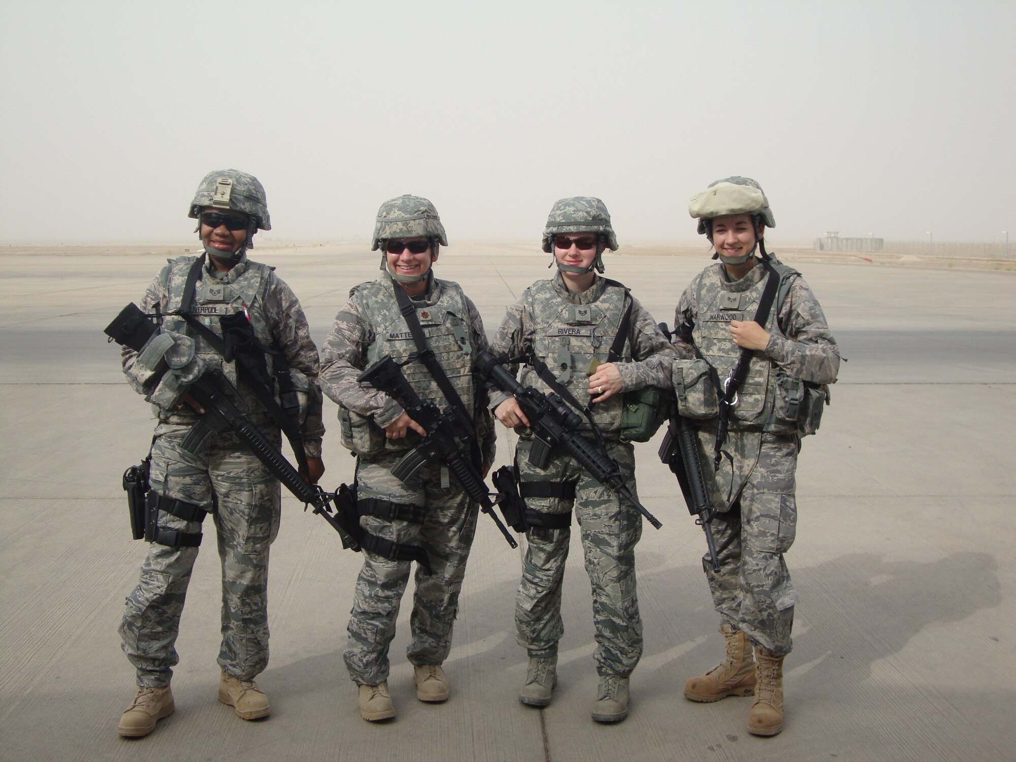 The dean of the Air Force Academy's Preparatory School, Lt. Col.  Alicia
Matteson (second from left), poses with her Combat Stress Control team
in Basra, Iraq, in 2010.  The Airmen are (from left to right)
then-Staff Sgt. Nekisha Liverpool, then-Tech. Sgt. Kimberley Rivera and
then-Staff Sgt. Anissa Miracle. (U.S. Air Force Academy/ Courtesy photo) 


