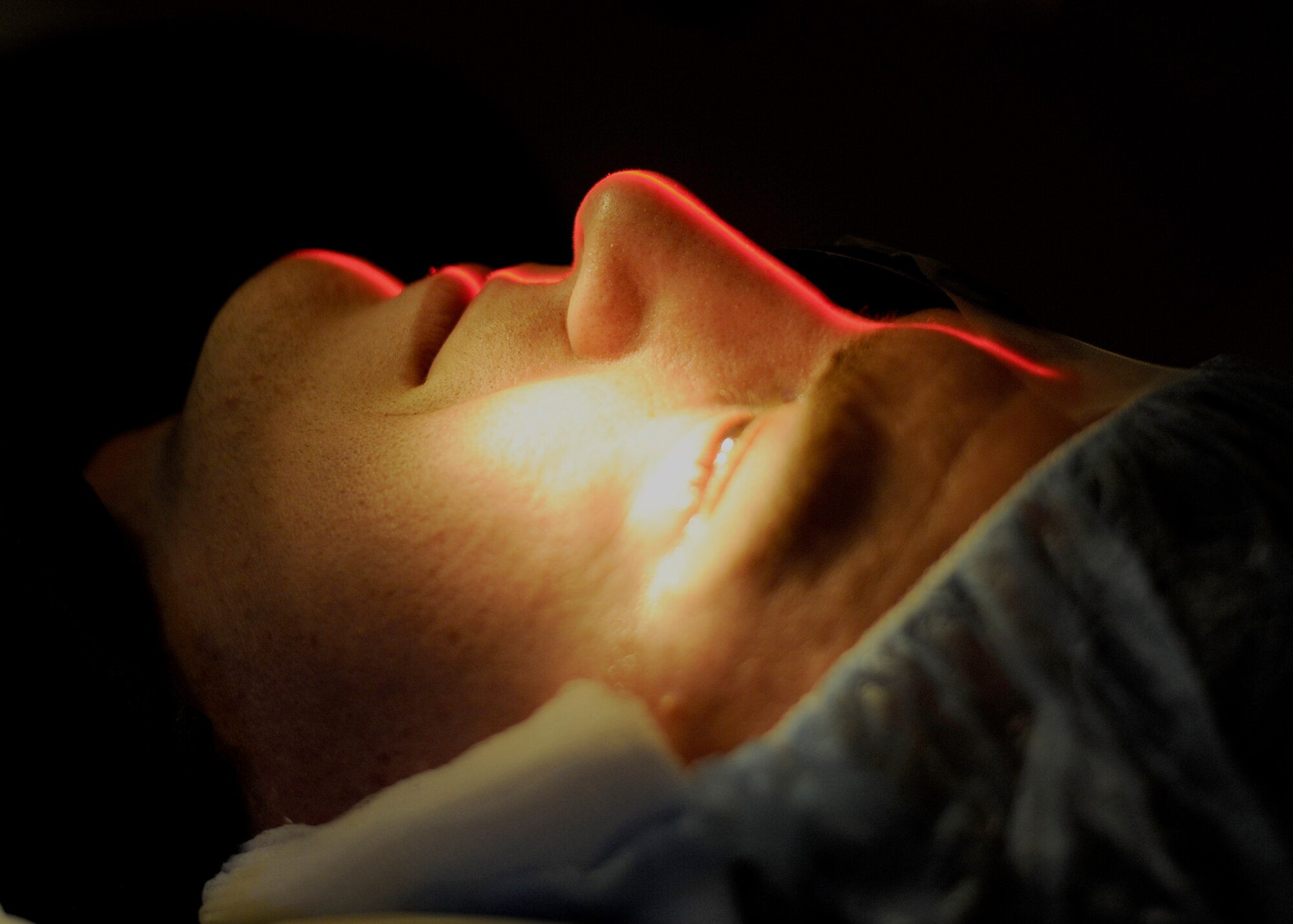 Capt. Frank Cumbie, 1st Helicopter Squadron pilot, lies motionless while surgical staff finds his face’s midline to a Photorefractive Keratectomy procedure March 18, 2015, in Malcolm Grow Medical Clinics and Surgery Center on Joint Base Andrews, MD. Centering the patient prior to PRK ensures the proper landmarks can be easily located during the procedure. (U.S. Air Force photo/Senior Airman Preston Webb)