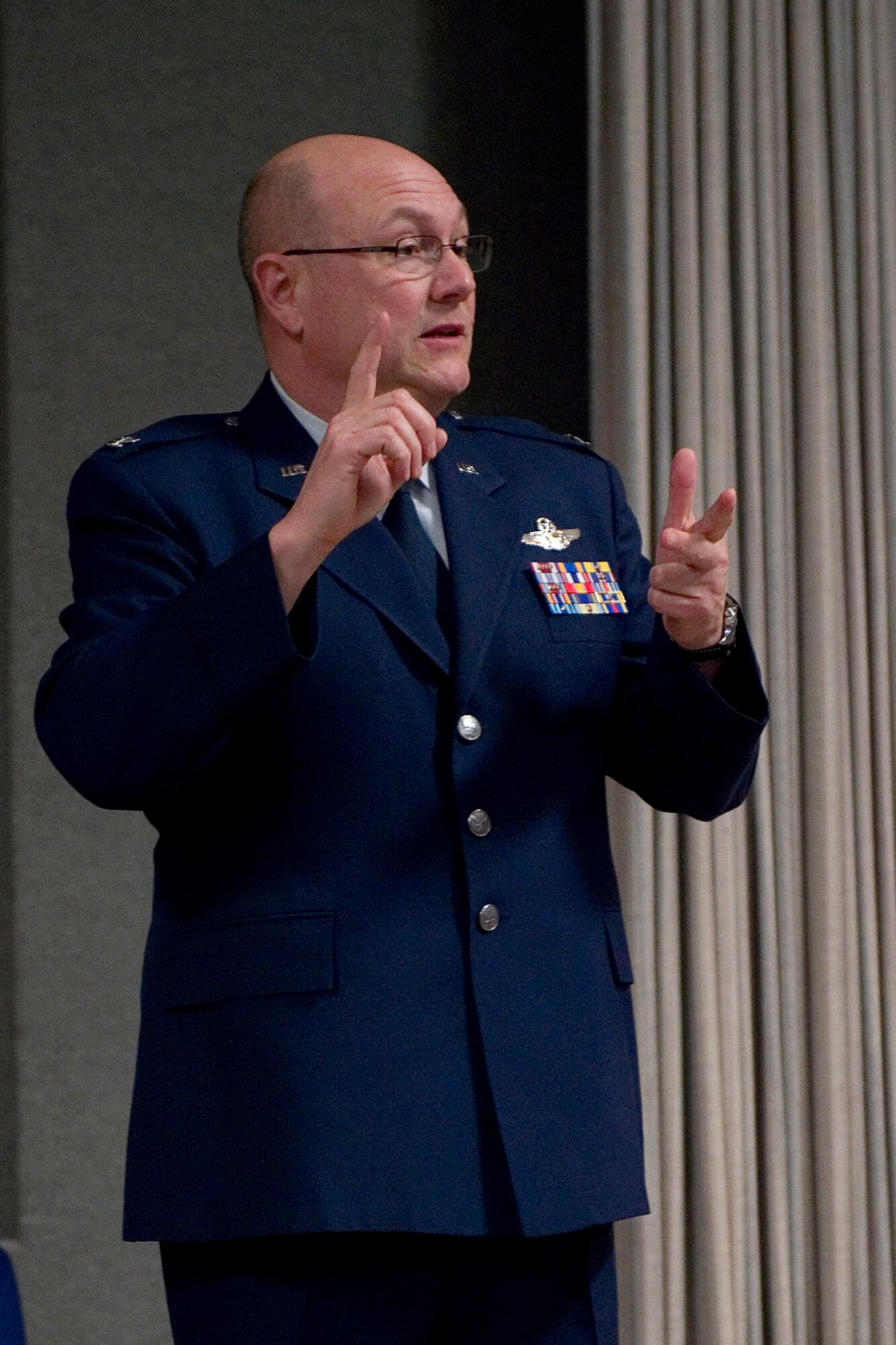 Col. Mark Sigler, 434th Operations Group commander, speaks to guests after assuming command of the 434th OG during a ceremony at Grissom Air Reserve Base, Ind., March 7, 2015. As the 434th OG commander, Sigler is responsible for the day-to-day operational training and overall management of two KC-135R flying squadrons and an operations support squadron. (U.S. Air Force photo/Tech. Sgt. Benjamin Mota)