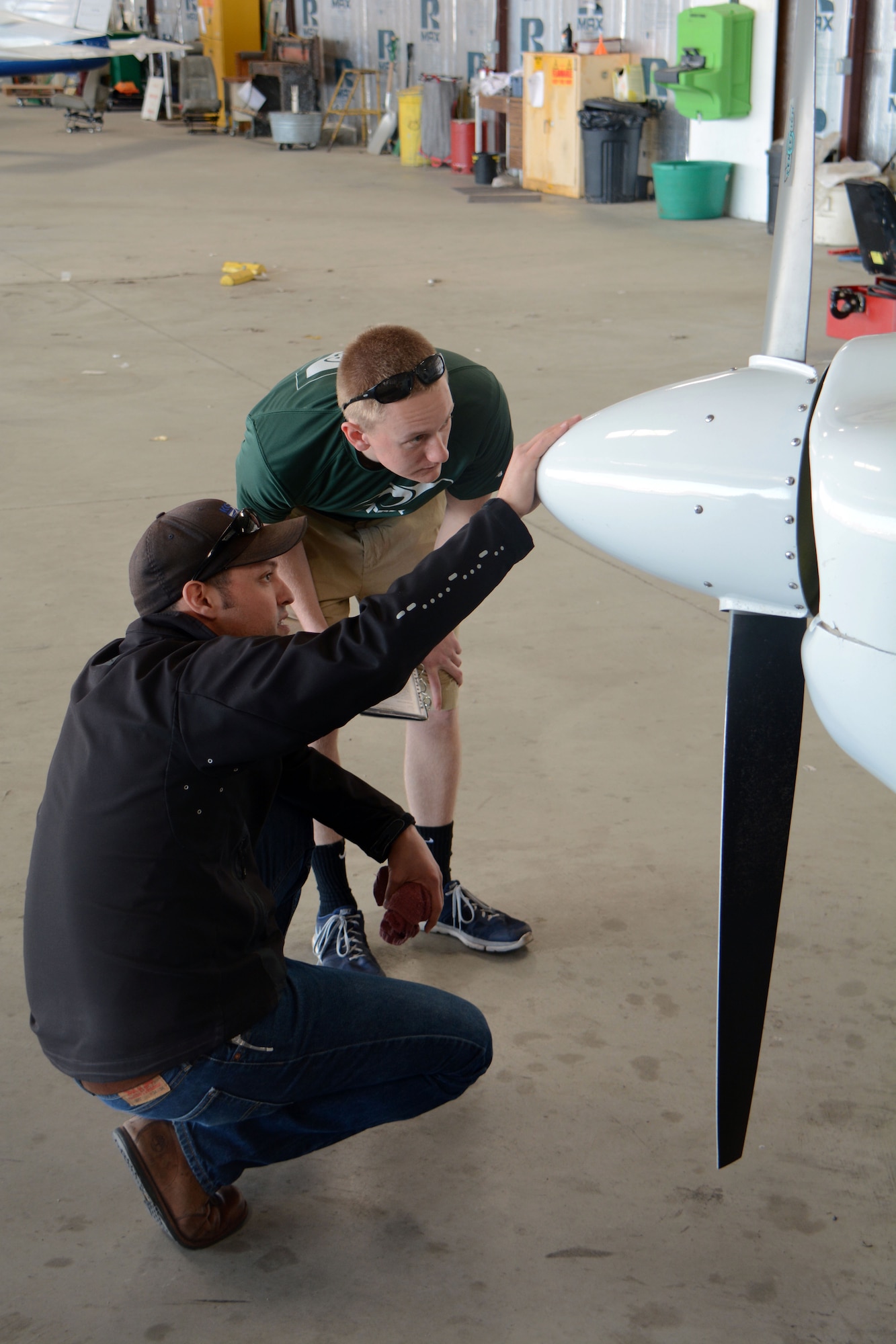 Airman 1st Class Scott Hartnett (Left), 60th Aircraft Maintenance Squadron and Jeff Lamont (Right), a Travis Aero Club flight instructor, perform a joint pre-flight inspection on a Piper Archer II  inside one of the Aero Club’s hangars in Rio Vista, Calif., March 5. Pre-flight inspections are critical to ensuring safe flights. (U.S. Air Force Photo/Tech. Sgt. James M. Hodgman)