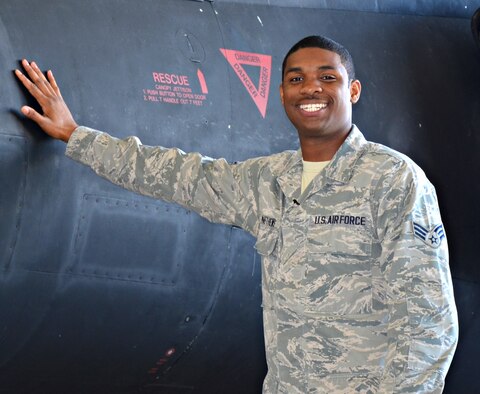 Senior Airman Terron Matthews, 9th Aircraft Maintenance Squadron U-2 assistant dedicated crew chief, poses for a photo next to a U-2 Dragon Lady at Beale Air Force Base, Calif., March 17, 2015. (U.S. Air Force photo by Airman 1st Class Ramon A. Adelan/Released)
