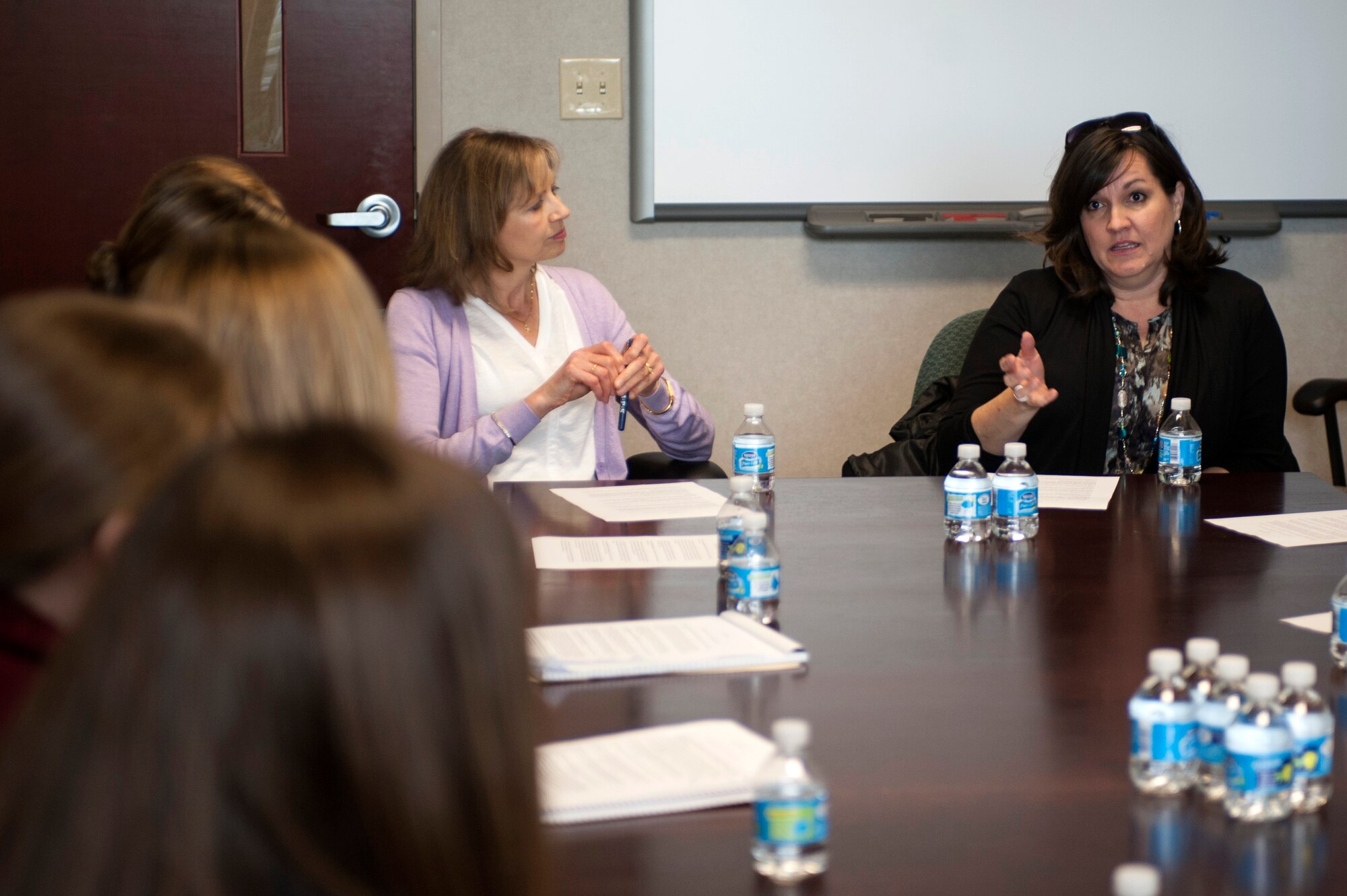 Mrs. Jennifer McDonald, wife of U.S. Air Force Chief Master Sgt. Steve McDonald, command chief of Air Combat Command, speaks to spouses from across the 1st Fighter Wing during a tour at Langley Air force Base, Va., March 13, 2015. During the meeting, McDonald and Mrs. Gillian Carlisle, wife of Gen. Hawk Carlisle, commander of Air Combat Command, addressed concerns and answered questions about issues facing military families including permanent-change-of-station moves, pilot retention, spouse career opportunities, deployments and military family issues. (U.S. Air Force photo by Senior Airman R. Alex Durbin/Released)