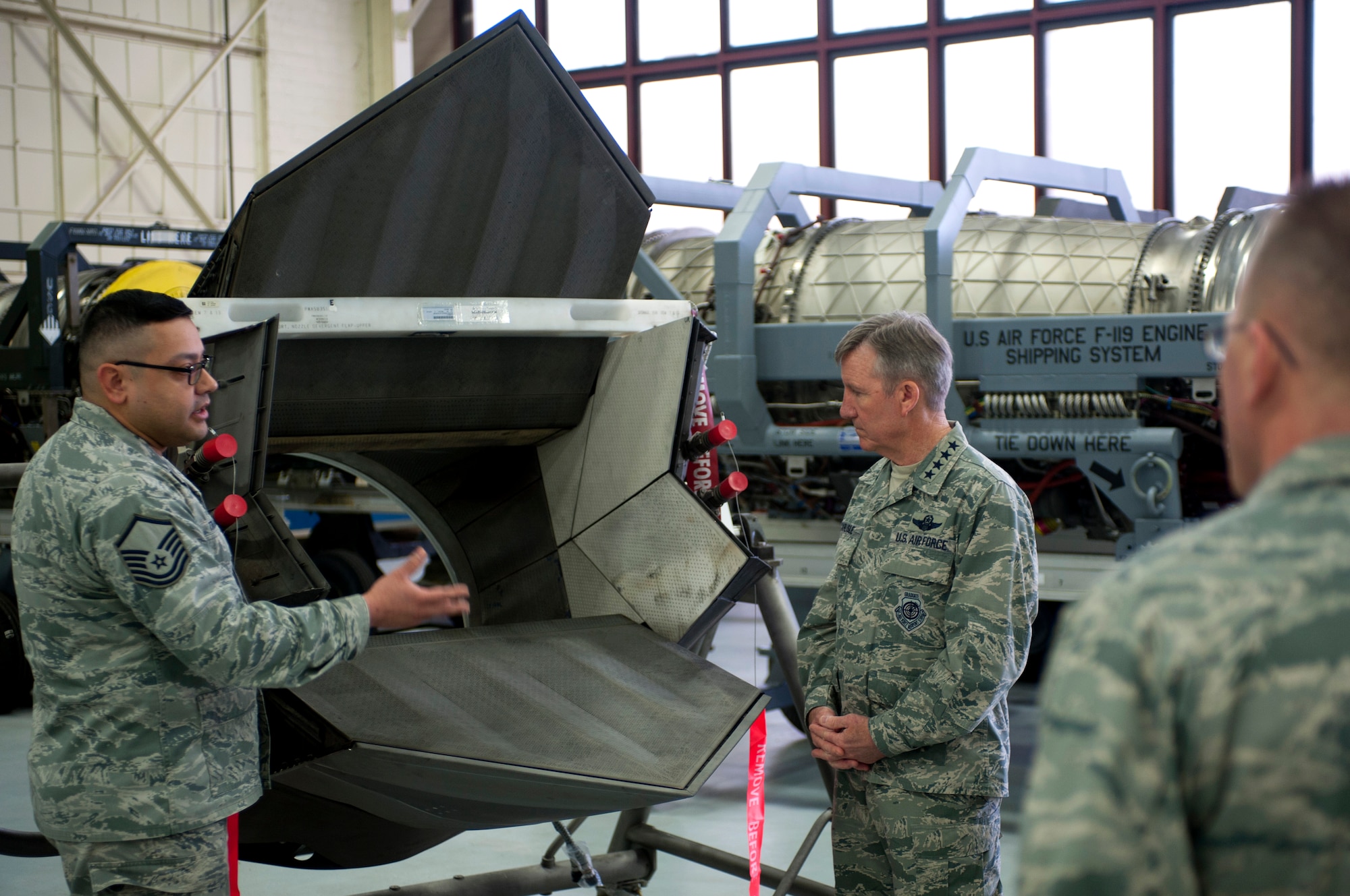 U.S. Air Force Gen. Hawk Carlisle, commander of Air Combat Command, listens to Master Sgt. Juan Trujillo, 1st Maintenance Squadron jet engine intermediate maintenance shop non-commissioned officer in charge, detail the shop’s role within the 1st Fighter Wing during an installation-wide tour at Langley Air Force Base, Va., March 13, 2015. Throughout the day, Carlisle visited units across Joint Base Langley-Eustis to see its diverse missions firsthand. (U.S. Air Force photo by Senior Airman R. Alex Durbin/Released)
