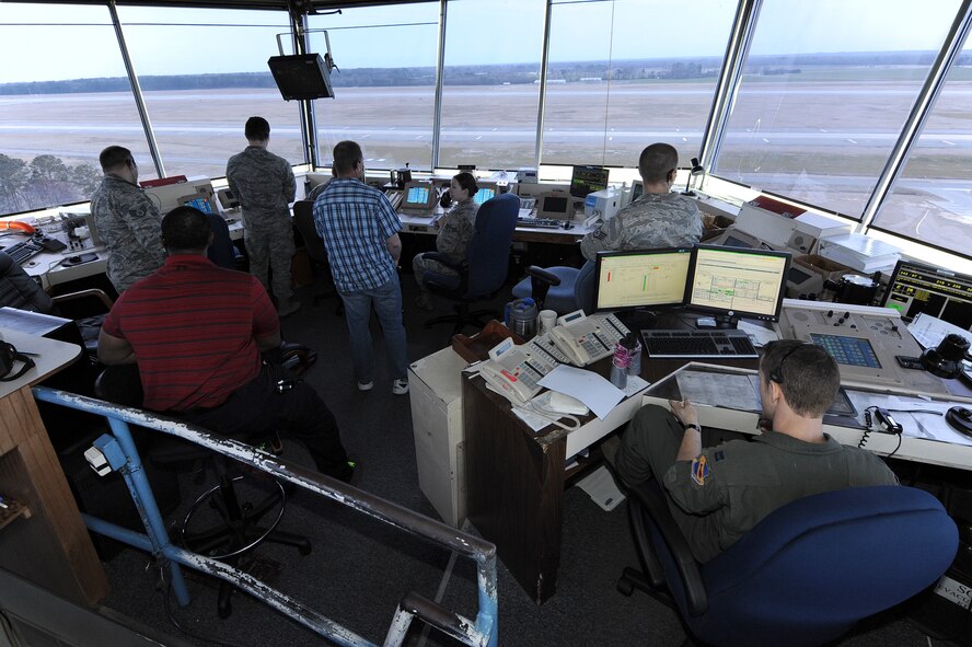 Airmen assigned to the 4th Operations Support Squadron air traffic control tower work their assigned stations during flying operations March 9, 2015, at Seymour Johnson Air Force Base, North Carolina. In 2014, along with their counterparts in Radar Approach Control, they monitored more than 94,000 aircraft operations, making Seymour Johnson AFB the third busiest installation in Air Combat Command. (U.S. Air Force photo/Airman 1st Class Aaron J. Jenne)