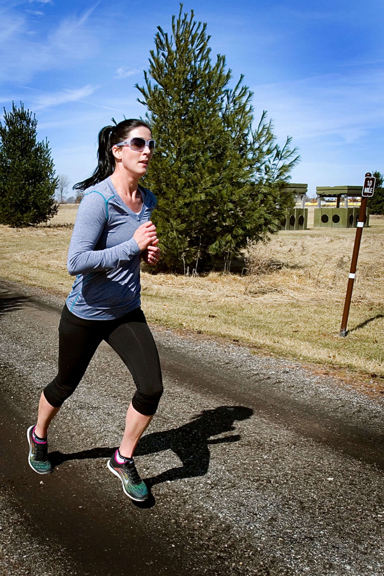 Kelly Strader, wife of Timothy Strader 434th Civil Engineer Squadron noncommissioned officer of equipment, heads into the last mile of an 8K race at Grissom Air Reserve Base, Ind., March 18, 2015. She was the overall winner of the race finishing in a time of 35:06. (U.S. Air Force photo/Tech. Sgt. Douglas Hays)