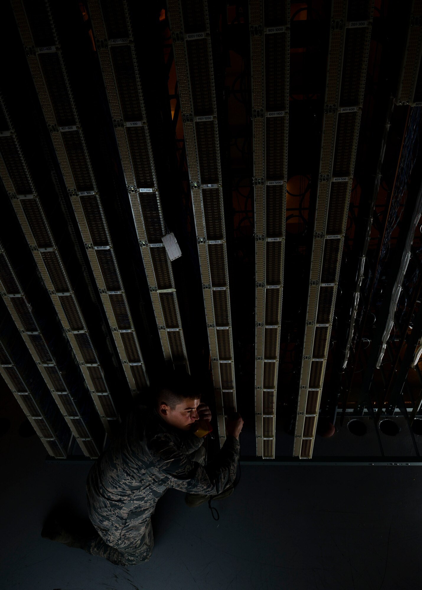 U.S. Air Force Airman 1st Class Dylan Breese, 31st Communications Squadron cyber transport systems technician, checks server connections at Aviano Air Base, Italy, March 17, 2015. While most Airmen work with the 31st CS concerning computer issues, many of their tasks require more behind-the-scenes attention, such as server maintenance. (U.S. Air Force photo by Senior Airman Austin Harvill/Released)