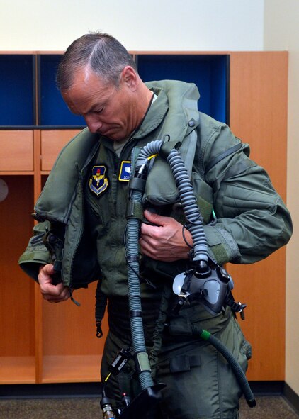 Brig. Gen. Scott Pleus, 56th Fighter Wing commander, suits up for his first F-35 sortie flight at Luke Air Force Base, Ariz., March 18, 2015. Pleus has been flying the F-16 for 22 years. (U.S. Air Force photo/Senior Airman Devante Williams)