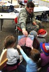 Volunteers from across the base read to children during the National Education Association’s “Read Across America” event on Minot Air Force Base, N.D., March 2-6, 2015. More than 90 Airmen and civilians volunteered at the Dr. Suess event.  This celebration occurs annually around Dr. Suess’ birthday. (U.S. Air Force photos/Senior Airman Kristoffer Kaubisch)