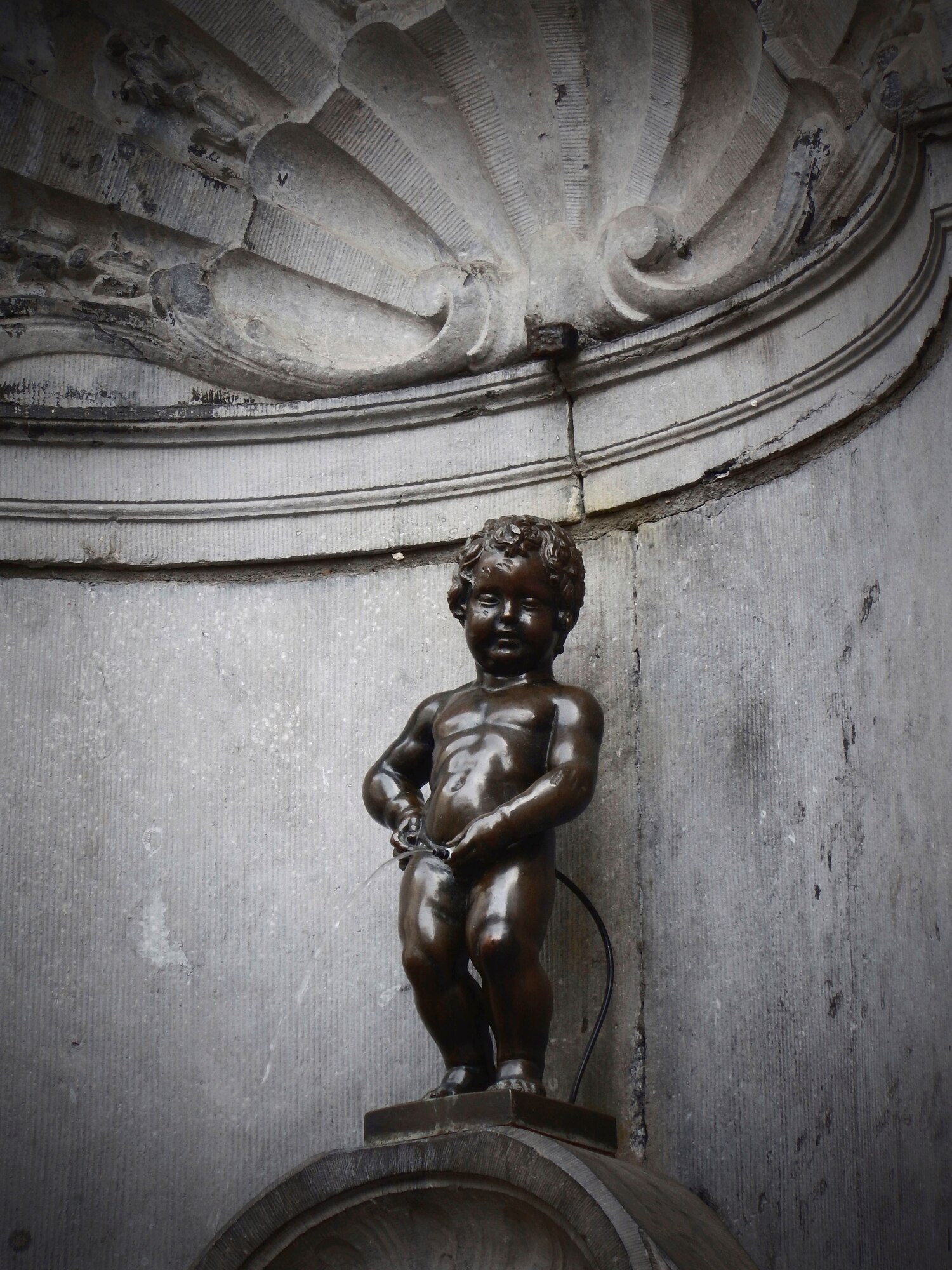 Manneken Pis, otherwise known as “the little boy urinating”, is a small sculpture in Brussels, Belgium. The statue stands at only two feet and can be found wearing different costumes a year. (U.S. Air Force photo by Senior Airman Matthew Lotz/Released)