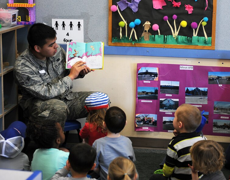Volunteers from across the base read to children during the National Education Association’s “Read Across America” event on Minot Air Force Base, N.D., March 2-6, 2015. More than 90 Airmen and civilians volunteered at the Dr. Suess event.  This celebration occurs annually around Dr. Suess’ birthday. (U.S. Air Force photos/Senior Airman Kristoffer Kaubisch)