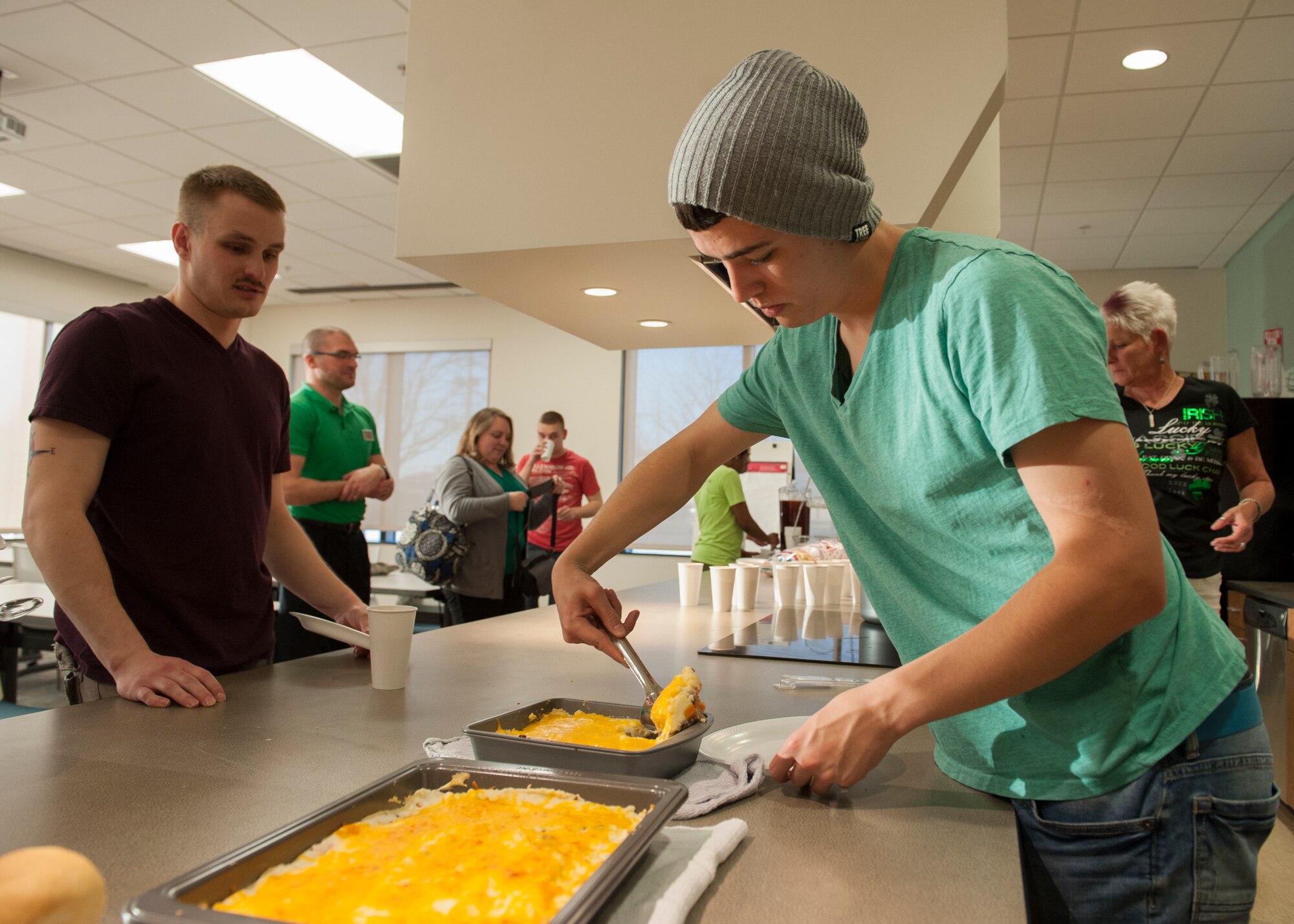 Airman 1st Class Mitch Dotson, 436th Aircraft Maintenance Squadron communication navigation technician, serves himself a helping of shepherd’s pie at a “Dorm to Gourm” class March 17, 2015, at Dover Air Force Base, Del. Dotson was one of a dozen Airmen to take part in this class. (U.S. Air Force photo/Airman 1st Class Zachary Cacicia)