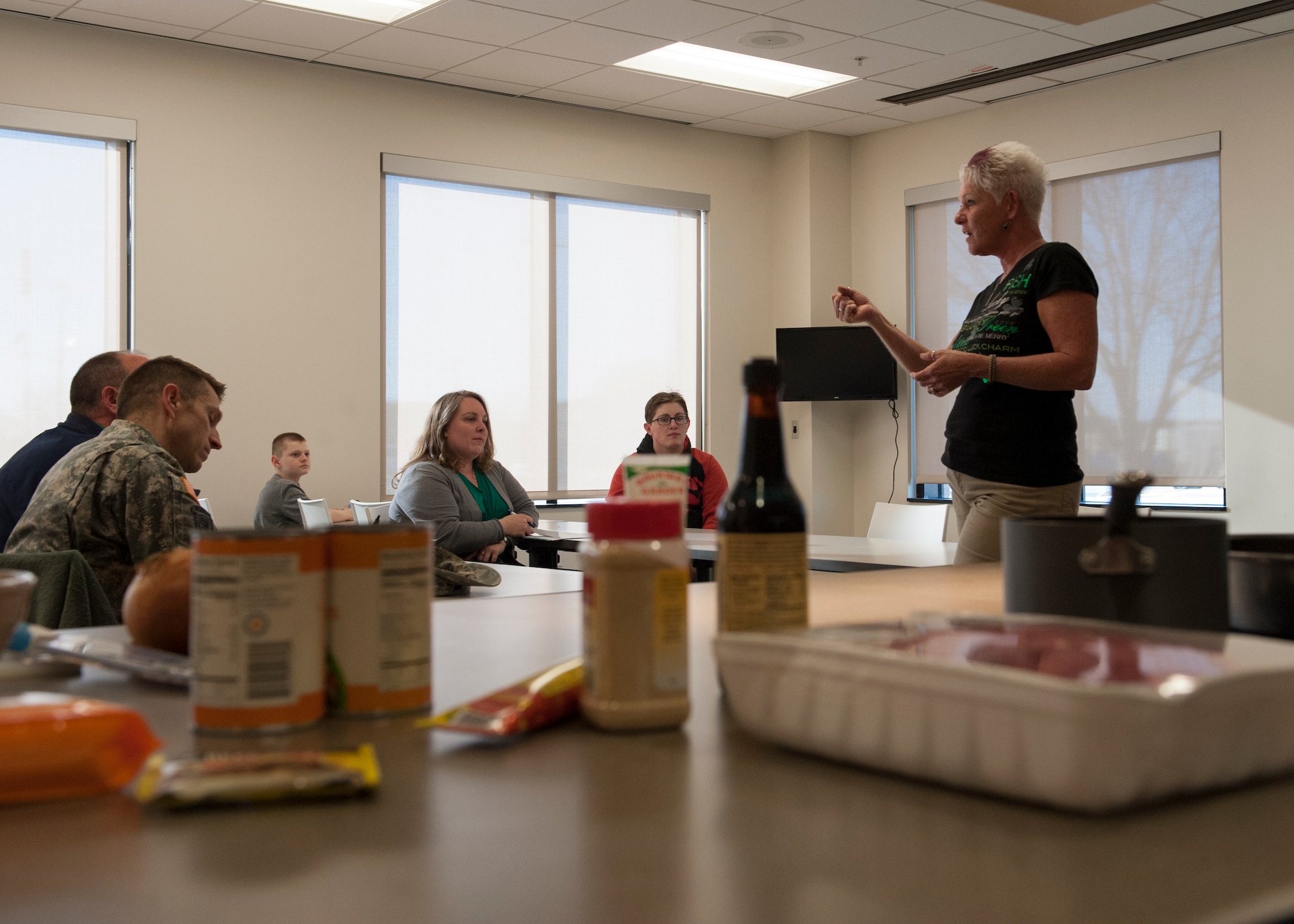 Dawne Nickerson-Banez, 436th Mission Support Group honorary commander, briefs a group from the Central Delaware Chamber of Commerce Military Affairs Committee prior to a “Dorm to Gourm” class March 17, 2015, at Dover Air Force Base, Del. The Military Affairs Committee attended the class to get a better understanding of some of the classes offered to Team Dover Airmen. (U.S. Air Force photo/Airman 1st Class Zachary Cacicia)