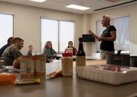 Dawne Nickerson-Banez, 436th Mission Support Group honorary commander, briefs a group from the Central Delaware Chamber of Commerce Military Affairs Committee prior to a “Dorm to Gourm” class March 17, 2015, at Dover Air Force Base, Del. The Military Affairs Committee attended the class to get a better understanding of some of the classes offered to Team Dover Airmen. (U.S. Air Force photo/Airman 1st Class Zachary Cacicia)
