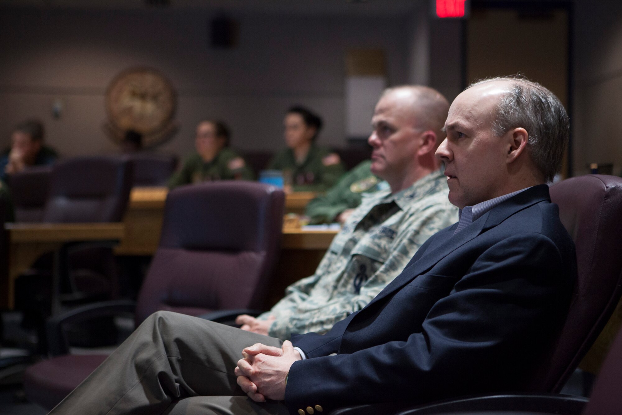 Brian McKeon (right), Principal Deputy Under Secretary of Defense for Policy, attends a pre-departure brief for missileers, at which they receive updates on the current environment, including road conditions, weather and upcoming maintenance, during his visit to F.E. Warren Air Force Base, March 16, 2015. McKeon’s visit aligns with the Department of Defense’s efforts to review and assess the status and direction of the nuclear enterprise, as well as the morale and welfare of the Airmen who carry out the nuclear mission, following the publication of the Nuclear Enterprise Reviews in 2014. The 90th Missile Wing houses and maintains 150 of the Minuteman III inter-continental ballistic missiles used in support of U.S. Strategic Command’s strategic deterrence mission, as well as the command and control systems required to launch them. U.S. Strategic Command is one of nine U.S. Department of Defense unified combatant commands, and is responsible for strategic deterrence, space operations, cyberspace operations, joint electronic warfare, global strike, missile defense, intelligence, surveillance and reconnaissance, combating weapons of mass destruction, and analysis and targeting. (U.S. Air Force photo by Lan Kim)
