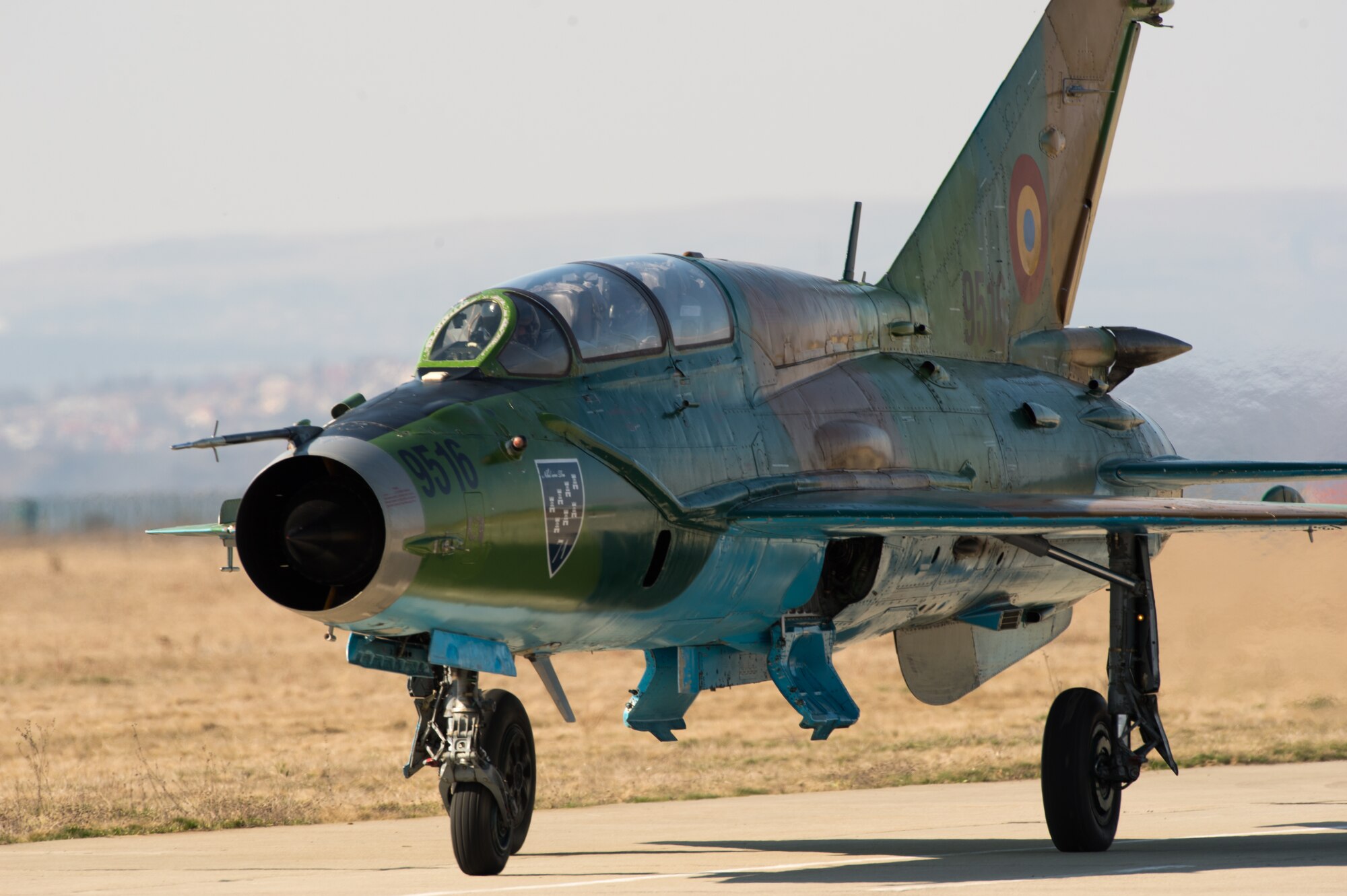 A Romanian MiG-21 taxis off the runway after a training sortie at Campia Turzii, Romania, March 17, 2015. Romanian and 480th Fighter Squadron Airmen trained together with more than 100 personnel from U.S. Air Force bases in Germany to establish a forward base and conduct operations from it. (U.S. Air Force photo/Staff Sgt. Armando A. Schwier-Morales)