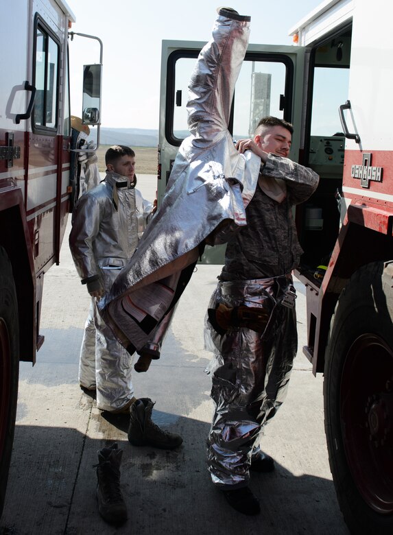 Senior Airman Scott Weeks, right, and Airman 1st Class Nathan Miller, 52nd Civil Engineer Squadron firefighters, conduct training during down time at Campia Turzii, Romania, March 16, 2015. The 52nd Fighter Wing and 435th Air Ground Operations Wing joined forces with the Romanian air force to conduct air and ground operations training during Dacian Warhawk, a two-week training mission designed to increase the interoperability between the U.S. and Romania. (U.S. Air Force photo/Staff Sgt. Armando A. Schwier-Morales)