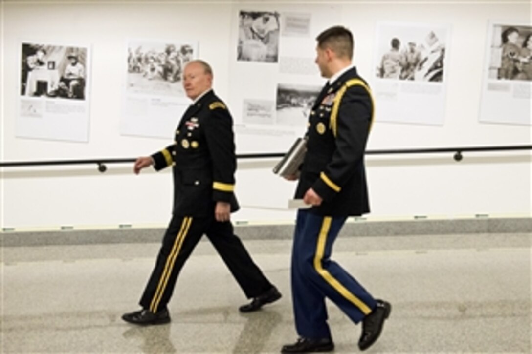 Army Gen. Martin E. Dempsey, chairman of the Joint Chiefs of Staff, views the newly unveiled photo exhibit, “National Memories,” at the Pentagon, March 18, 2015. The exhibit sheds new light on the U.S.-China relationship during World War II, showing American and Chinese troops working together during the war.