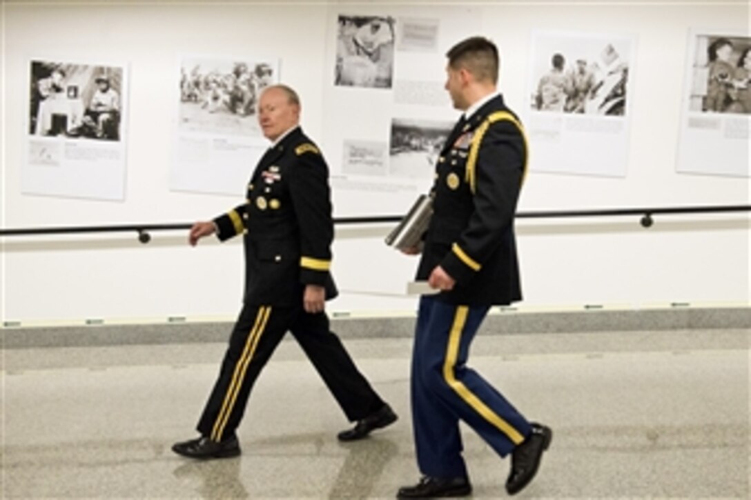 Army Gen. Martin E. Dempsey, chairman of the Joint Chiefs of Staff, views the newly unveiled photo exhibit, “National Memories,” at the Pentagon, March 18, 2015. The exhibit sheds new light on the U.S.-China relationship during World War II, showing American and Chinese troops working together during the war.