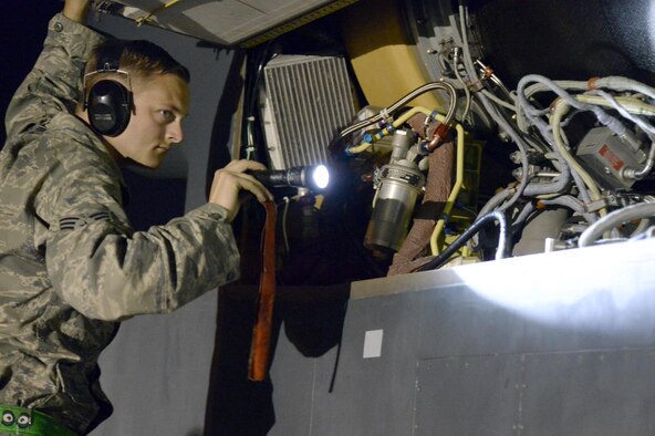 Senior Airman Aaron, crew chief, checks the engine of a RQ-4 Global Hawk for leaks at an undisclosed location in Southwest Asia Mar. 7, 2015. Crew chiefs inspect, launch, recover and perform heavy maintenance on the jet. Aaron is currently deployed from Grand Forks AFB, N.D., and a native of Tallassee, Ala. (U.S. Air Force photo/Tech. Sgt. Marie Brown)