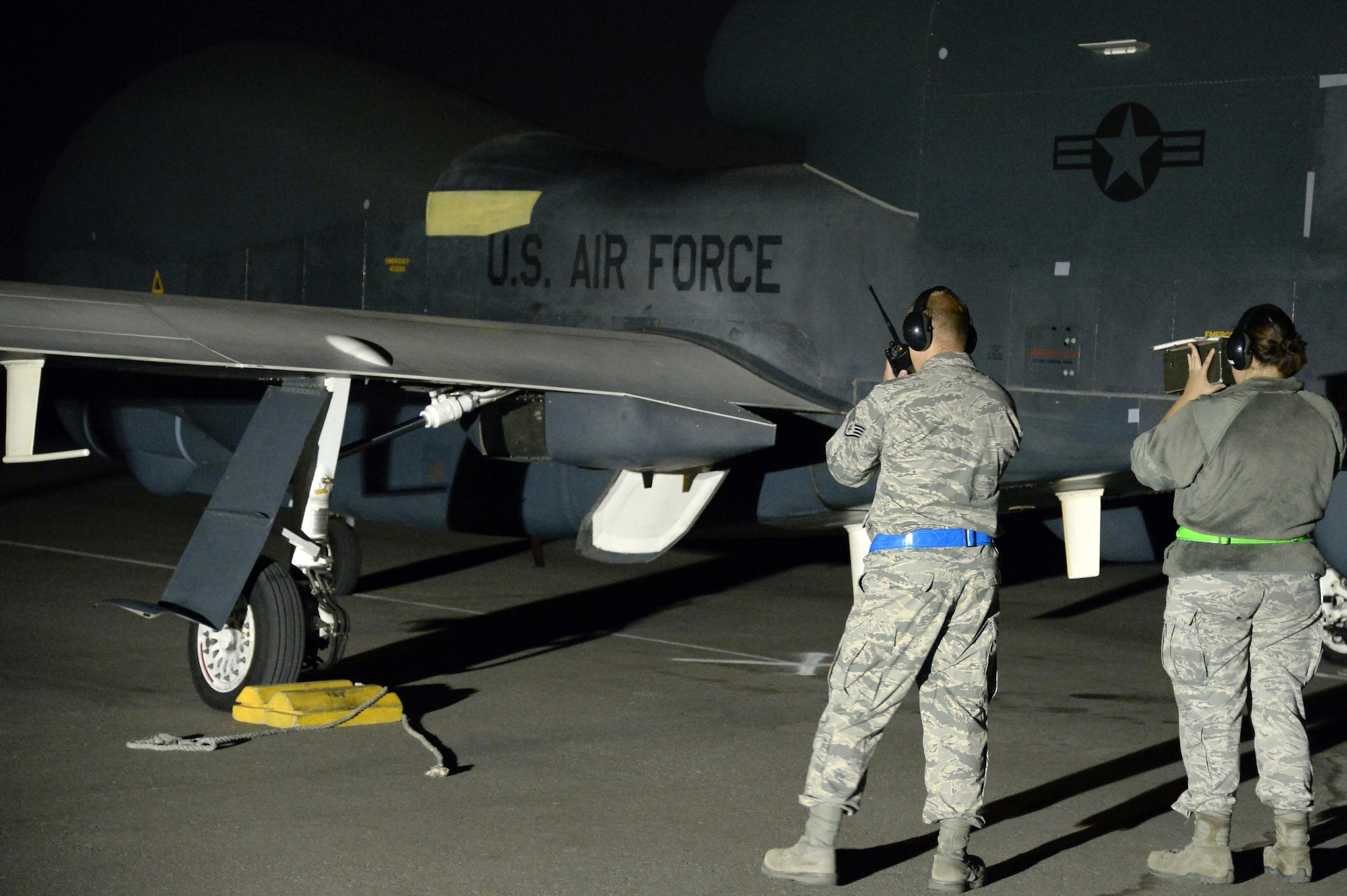 Staff Sgt. Paul, left, crew chief, and Airman 1st Class Casey, avionics specialist, verify operation of the Identification Friend or Foe system on a RQ-4 Global Hawk at an undisclosed location in Southwest Asia Mar. 7, 2015. A transponder is used to send a signal that requests the aircraft’s identification and the aircraft sends a signal back verifying the test was successful. Paul is currently deployed from Grand Forks Air Force Base, N.D., and is a native of Pittsburgh, Pa. Casey is currently deployed from Grand Forks Air Force Base, N.D. (U.S. Air Force photo/Tech. Sgt. Marie Brown)
