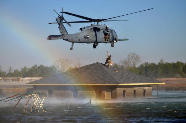 Pararescue jumpers and combat rescue officers conduct a search and rescue response during Katrina-like flood training March 8, 2015, in Perry, Ga. The four-day exercise used HH-60 Pave Hawks and MV-22 Ospreys for simulated scenarios that included earthquake collapsed buildings, vehicle-borne improved explosive devices detonating, and mass casualty response. The pararesue jumpers and rescue officers are from the 920th Rescue Wing at Patrick Air Force Base, Fla. (U.S. Air Force photo/Staff Sgt. Kelly Goonan)