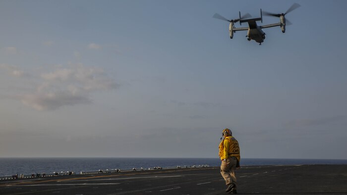 A  U.S. Marine Corps MV-22B Osprey flies away from the USS Bonhomme Richard (LHD 6), at sea, March 19, 2015. The Osprey is transporting Marines to execute a vertical assault exercise on Ie Shima, Okinawa, Japan. The Ospreys are with Marine Medium Tiltrotor Squadron 262 (Reinforced), 31st Marine Expeditionary Unit. The Marines are with Company E, Battalion Landing Team 2nd Battalion, 4th Marines, 31st MEU, and are currently on the MEU’s annually-scheduled Spring Patrol of the Asia-Pacific region.