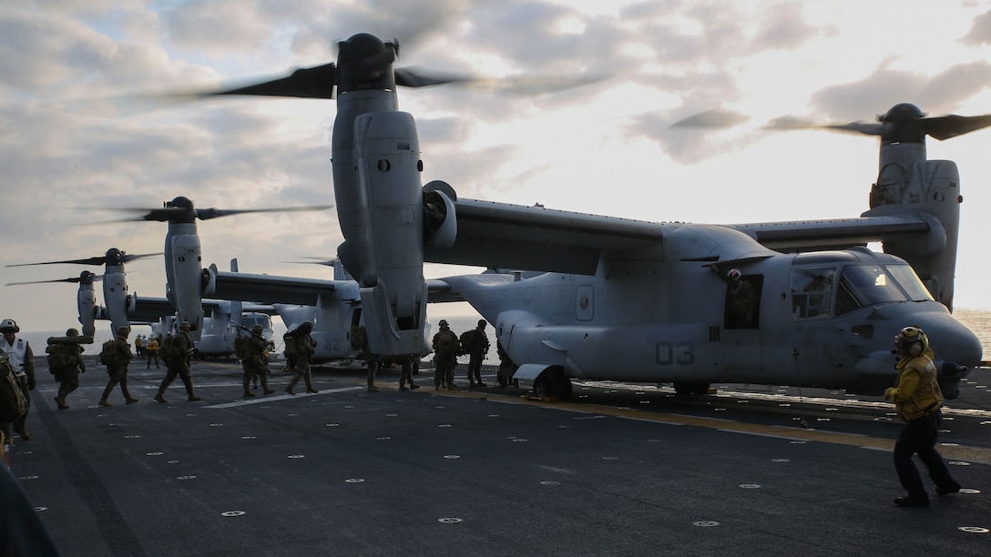 U.S. Marines walk towards MV-22B Ospreys the flight deck of the USS Bonhomme Richard (LHD 6) March 19, 2015. The Marines are preparing for a vertical assault exercise on Ie Shima, Okinawa, Japan. The Ospreys are with Marine Medium Tiltrotor Squadron 262, 31st Marine Expeditionary Unit. The Marines are with Company E., Battalion Landing Team 2nd Battalion, 4th Marines, 31st MEU and are currently participating in Certification Exercise during their Spring Patrol of the Asia-Pacific region. 