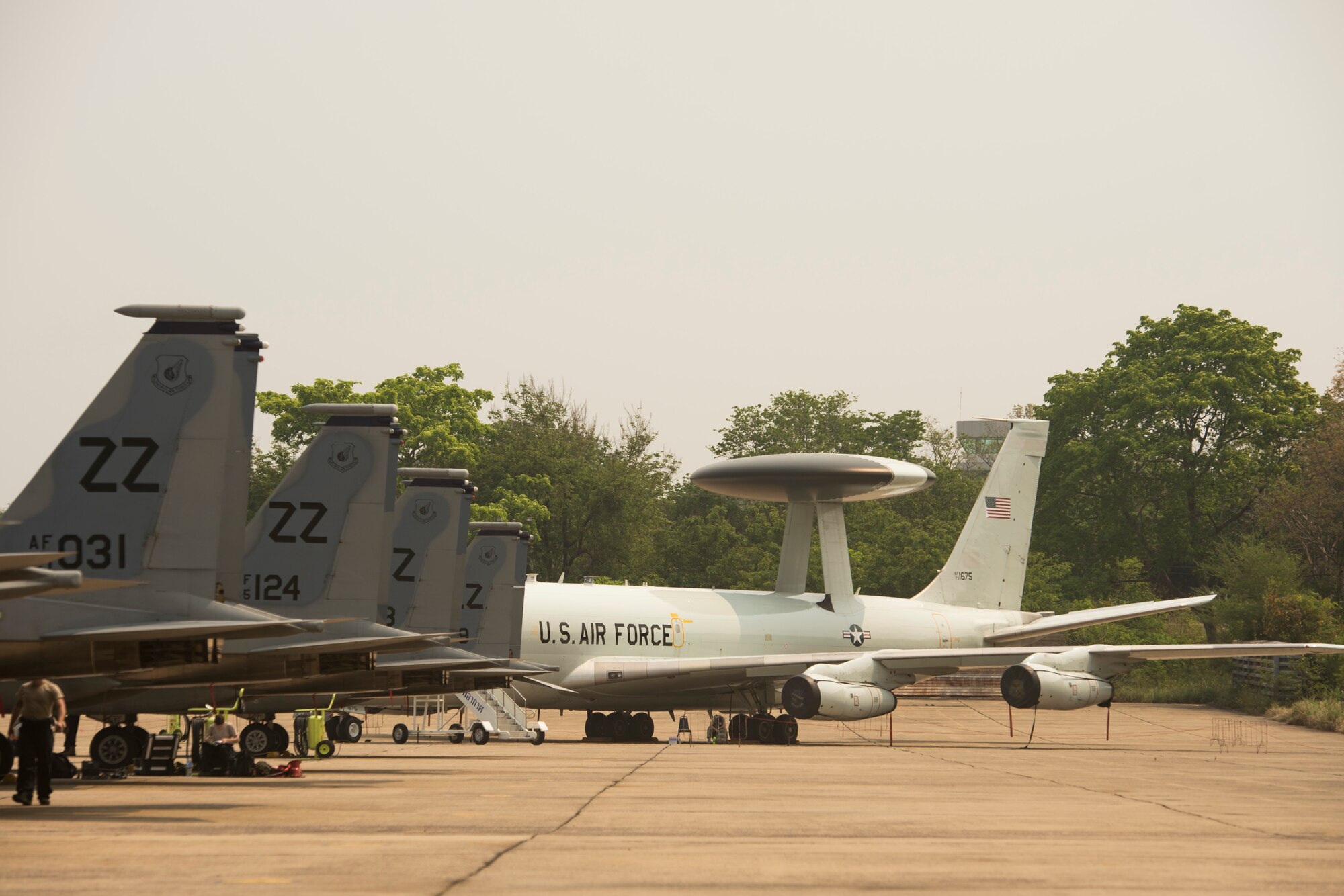 Multiple U.S. Air Force F-15 Eagles and an E-3 Sentry (AWACS) participate in exercise Cope Tiger 15 March 17, 2015, in Korat, Thailand. CT15 included 22 total flying units and over 1390 personnel from three countries and continues the growth of strong, interoperable, and beneficial relationships within the Asia-Pacific region. The exericse focused on integration of airborne and land-based command and control assets.(U.S. Air Force photo/Airman 1st Class Taylor Queen)